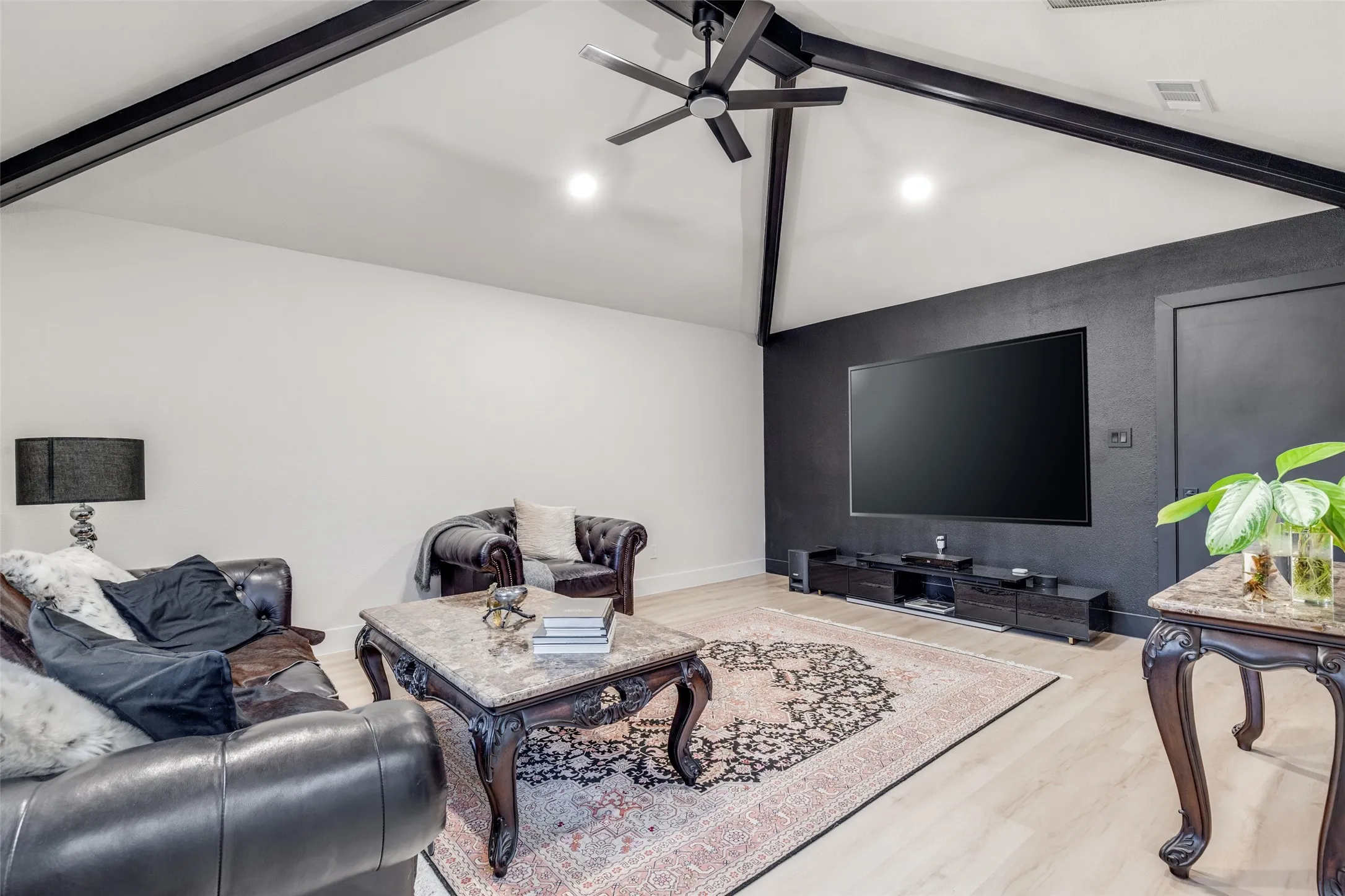 A cozy living room, perfect for those cooler fall days coming up. *TV virtually staged for presentation purposes*
