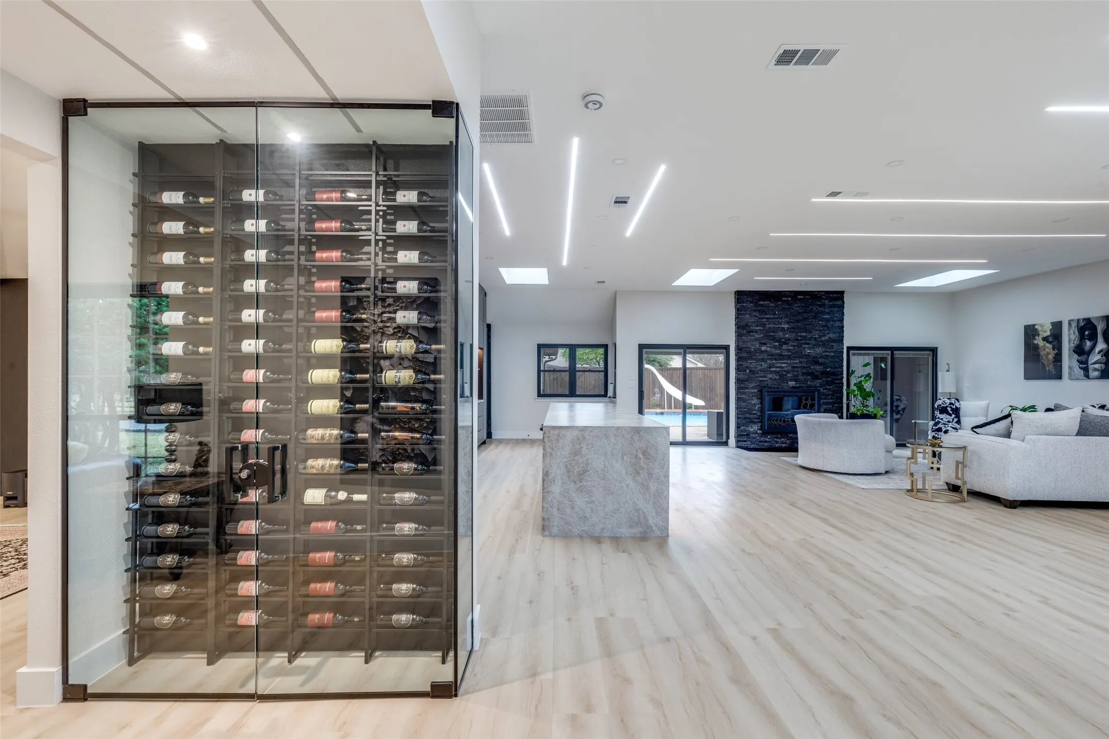 Hello, gorgeous! A floor to ceiling glass wine cellar, perfect for friends and family to enjoy.
