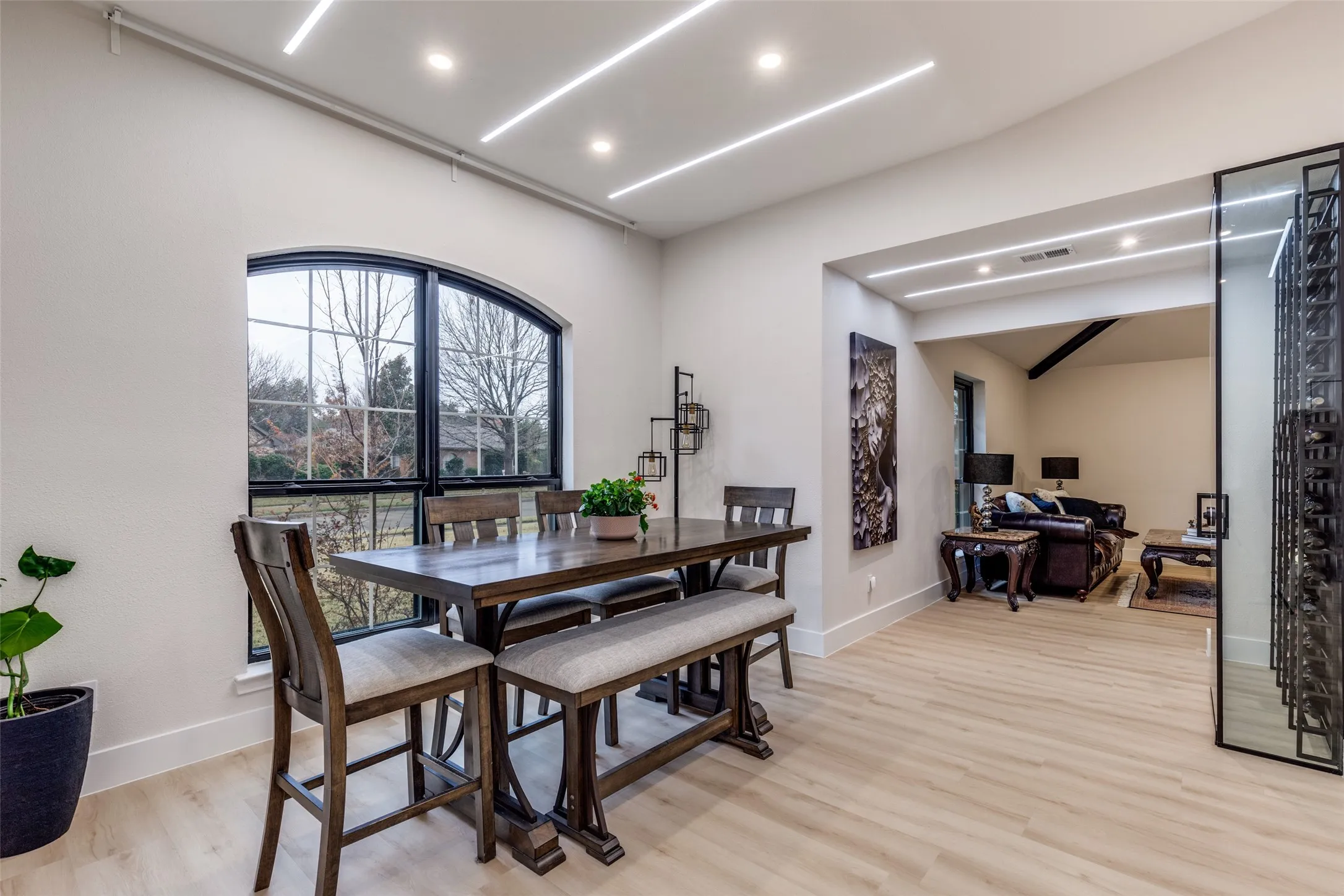 Dining area looks over the wine cellar and second living space.