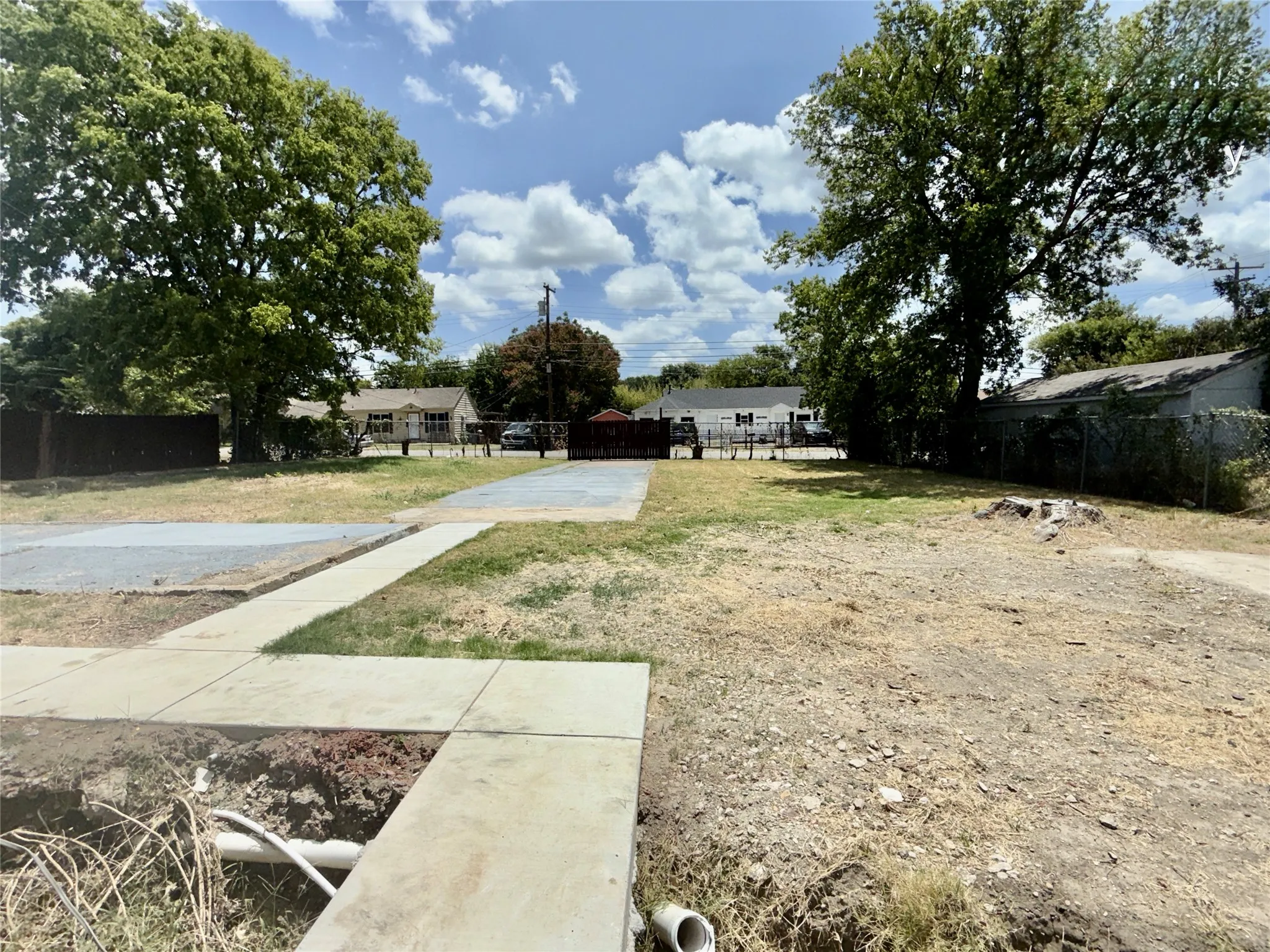 Front yard with sidewalk leading to driveway