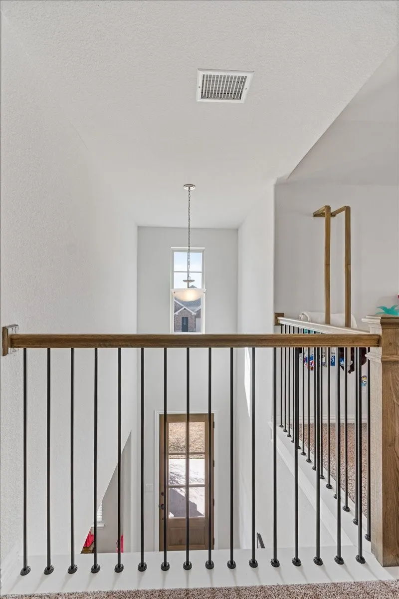 Corridor featuring visible vents