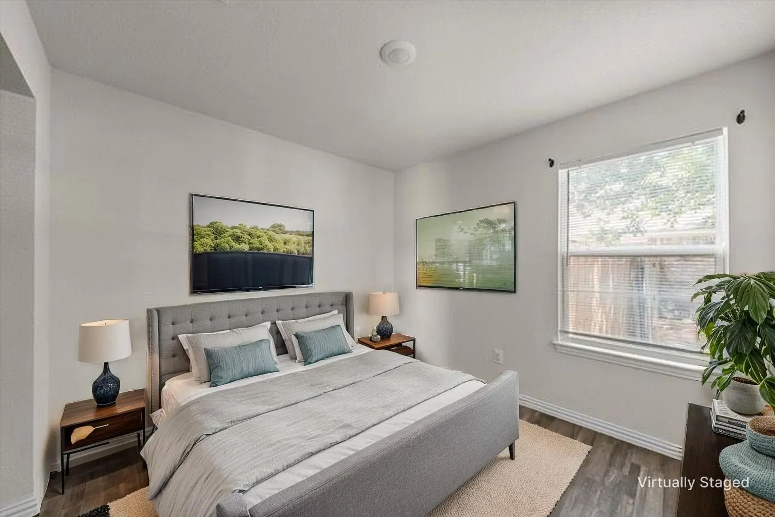 Recessed ceiling lighting, a single window with blinds, and wood-finish flooring