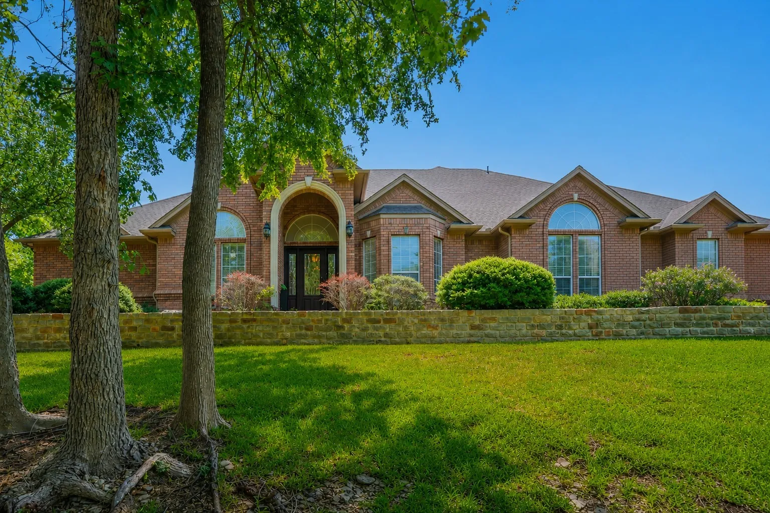 Gorgeous 4 bedroom home on 1.78 acres with mature trees.