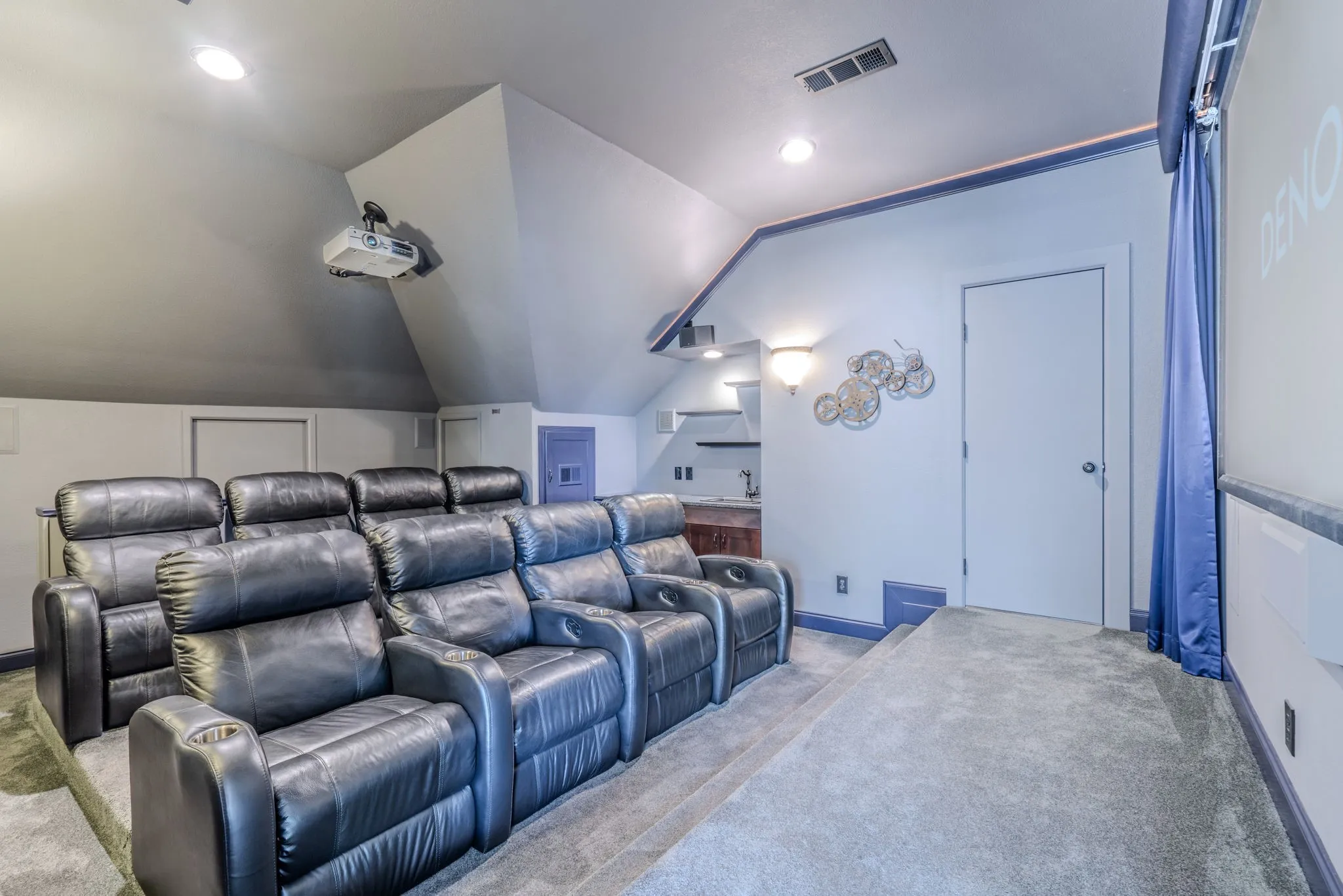 Impressive media room with 8 recliners and 120 inch screen! Let us show you in person!