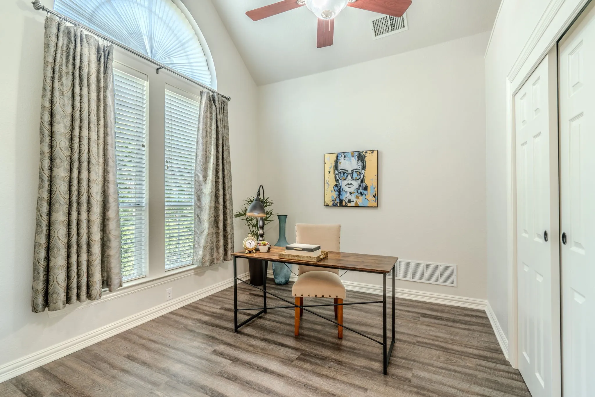 This is the 4th bedroom with a large closet, windows, LVP flooring, and ceiling fan OR use this room as an office.