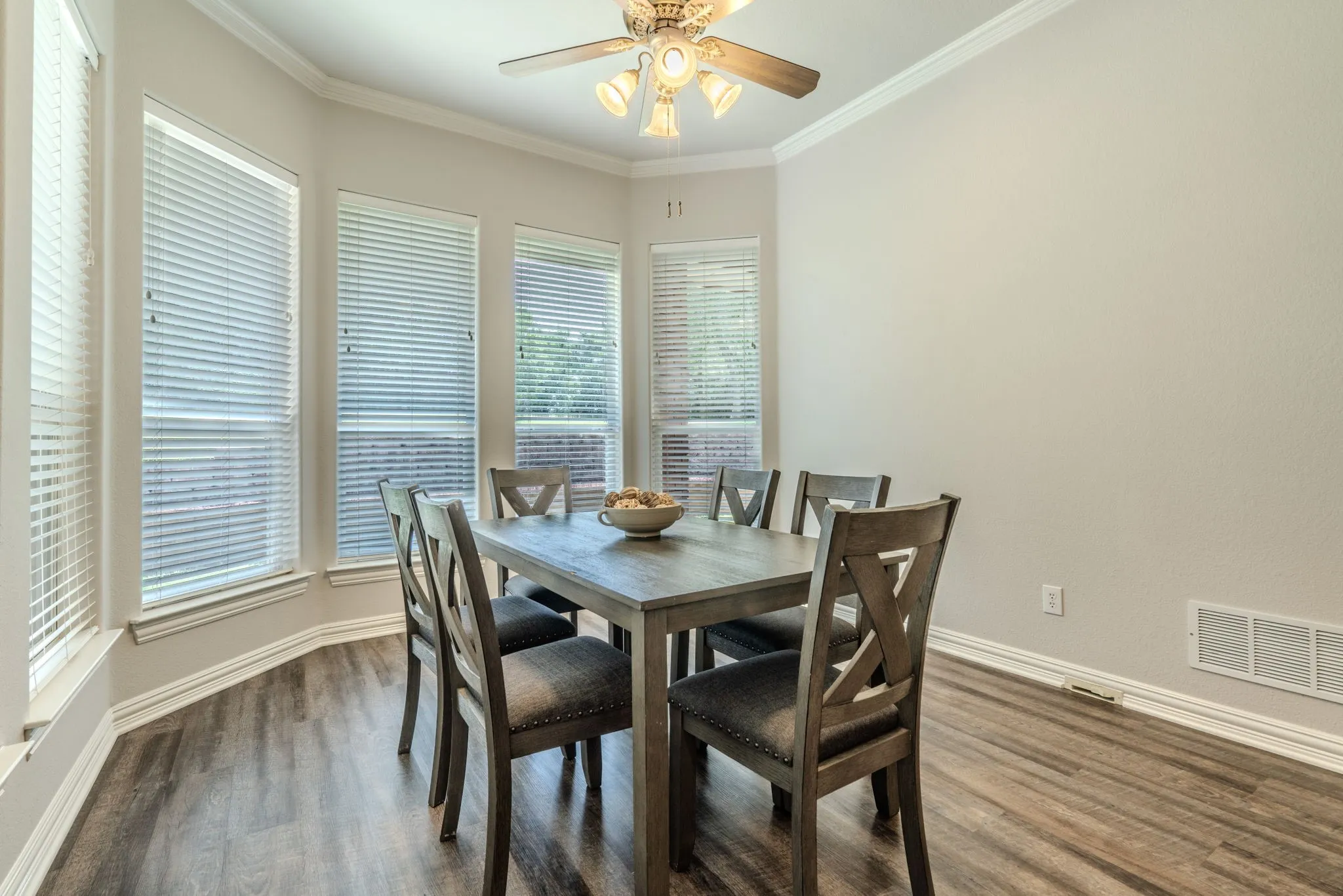 Spacious breakfast area featuring LVP flooring, and faceted bay window.