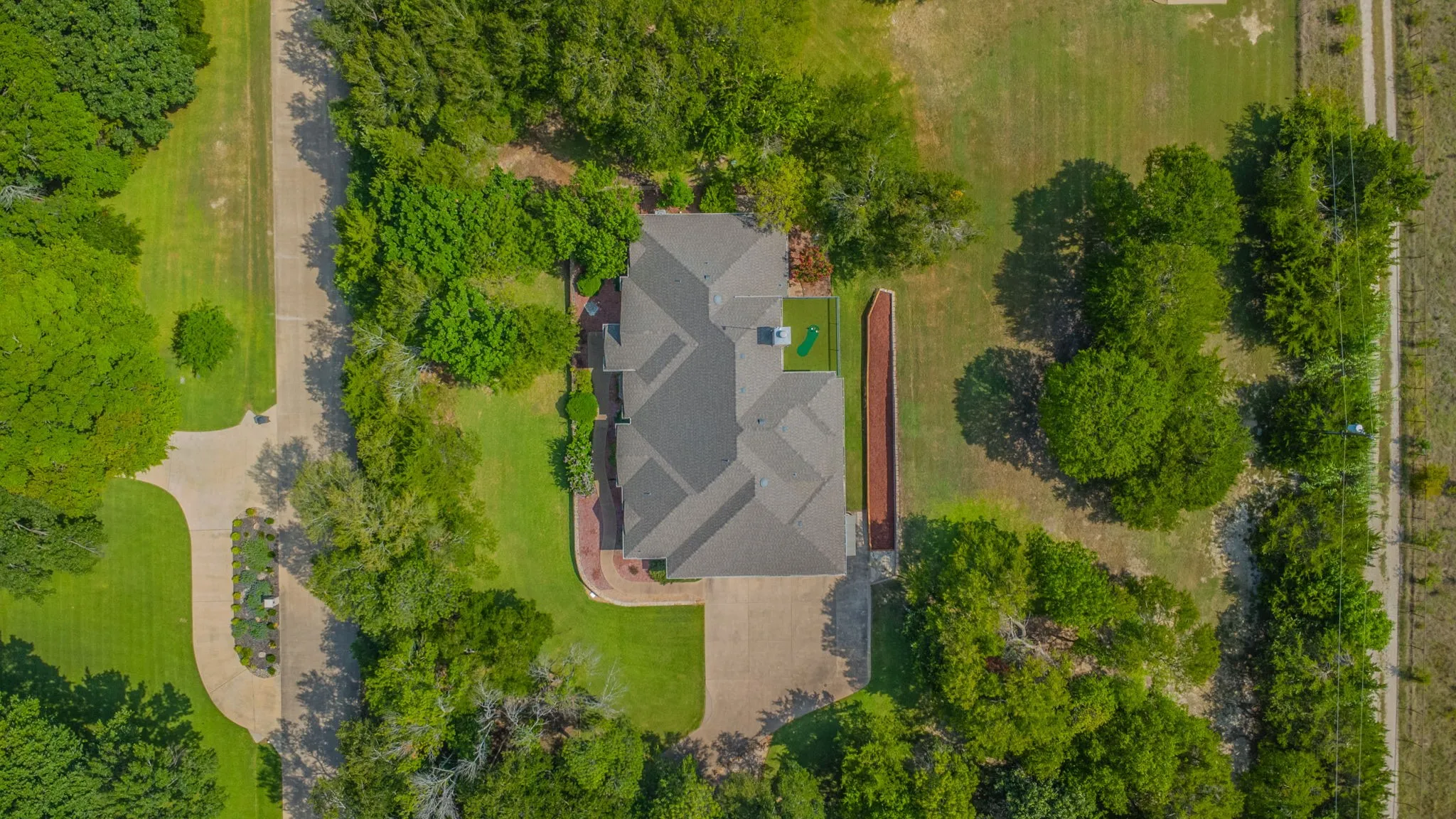 Aerial view of this amazing property with 1.78 acres with trees and NO neighbors right up on you!