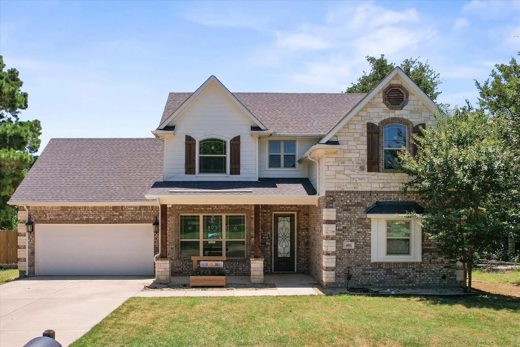 Covered front porch and attractive front door add to the wonderful curb appeal!