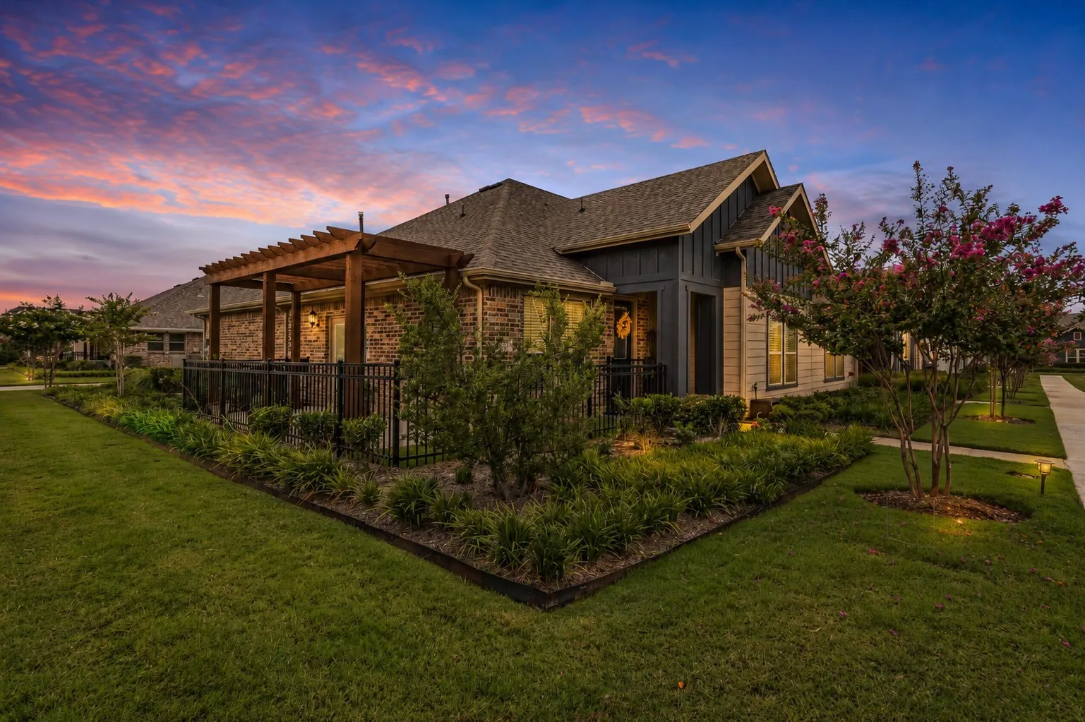Twilight view of the corner lot of 1005 4th St, Argyle, TX in Harvest in Denton County, Texas