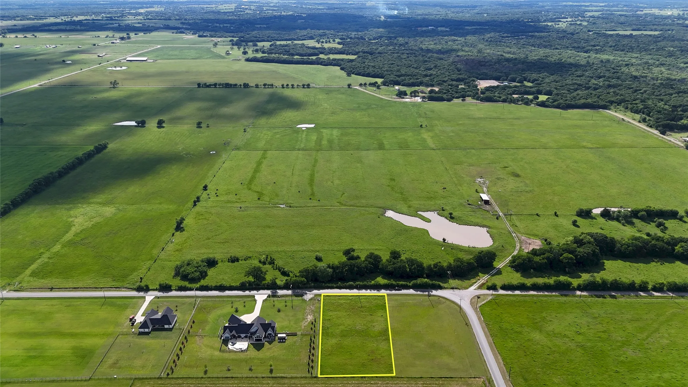 Expansive green acreage featuring a clear parcel of land