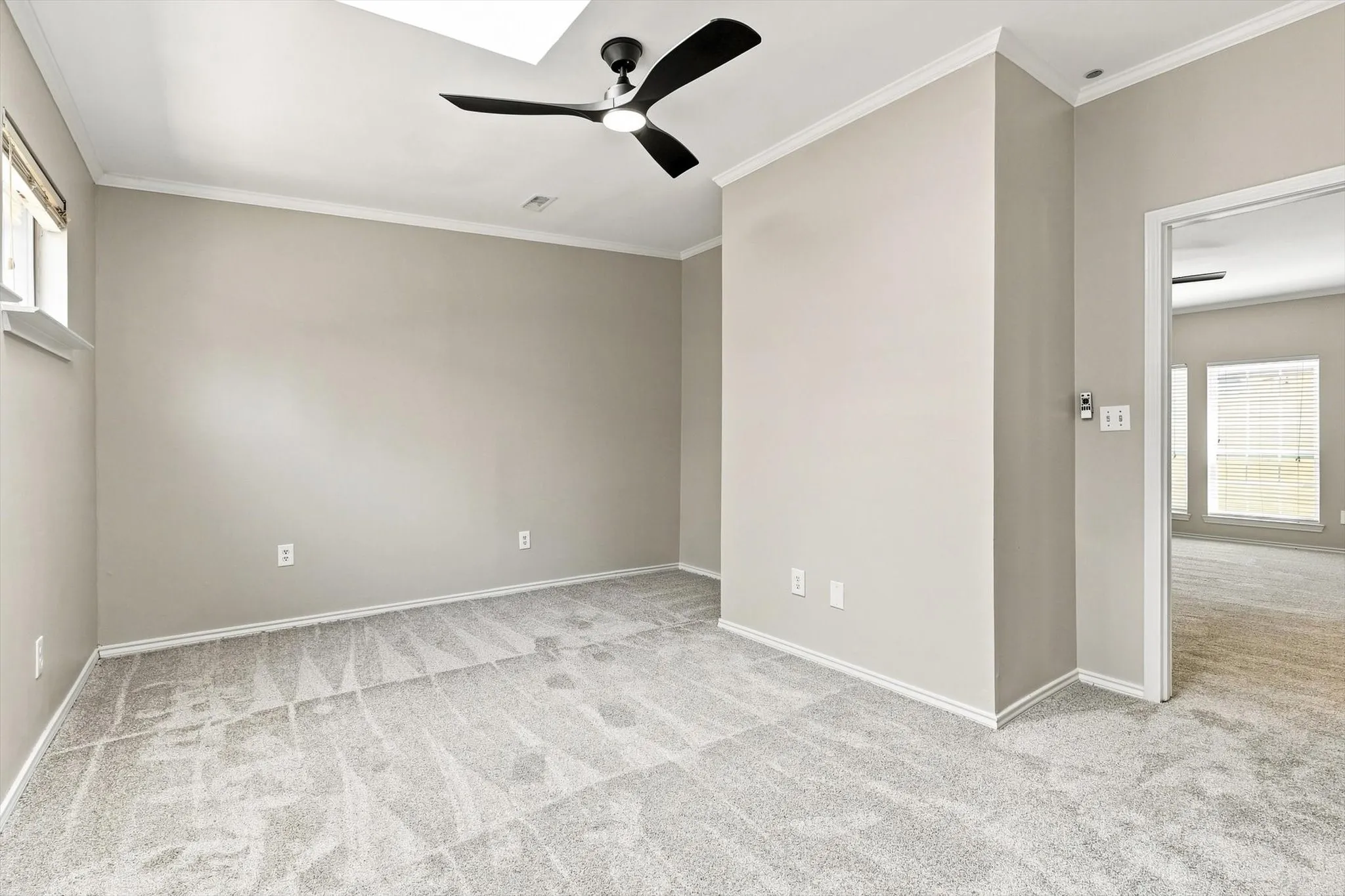 can be used as a 3rd bedroom modern ceiling fan, crown molding, and a window for natural light