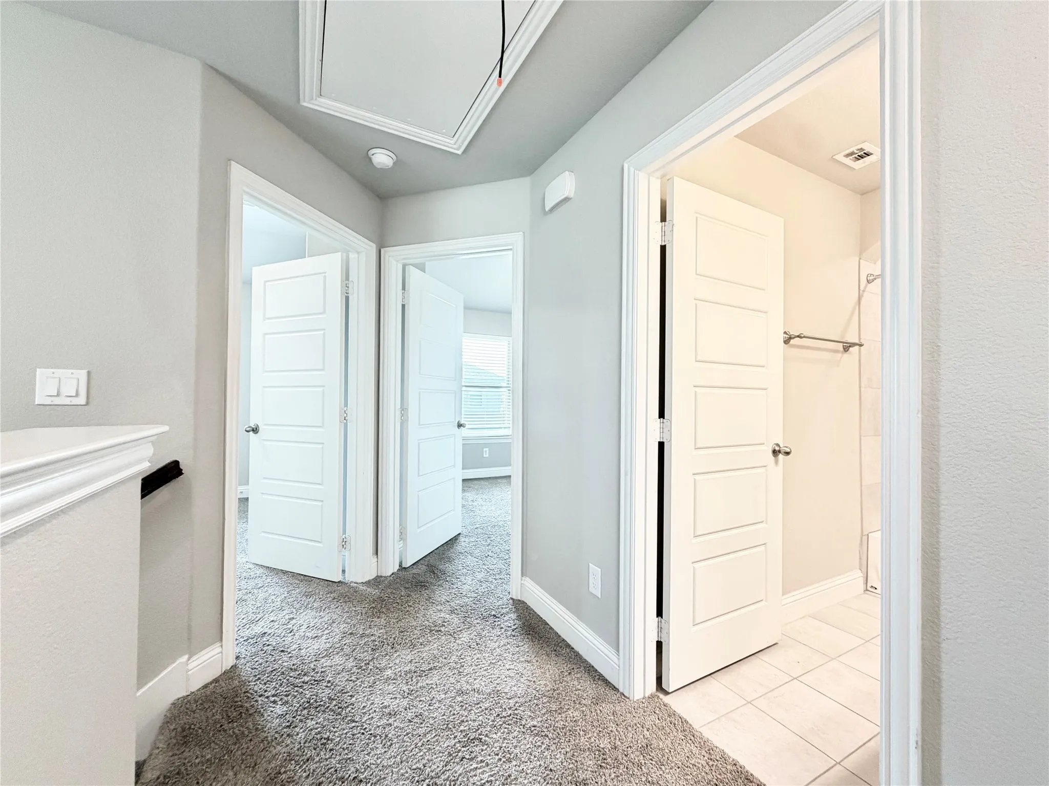 Upstairs hallway, view of bedrooms and full bathroom