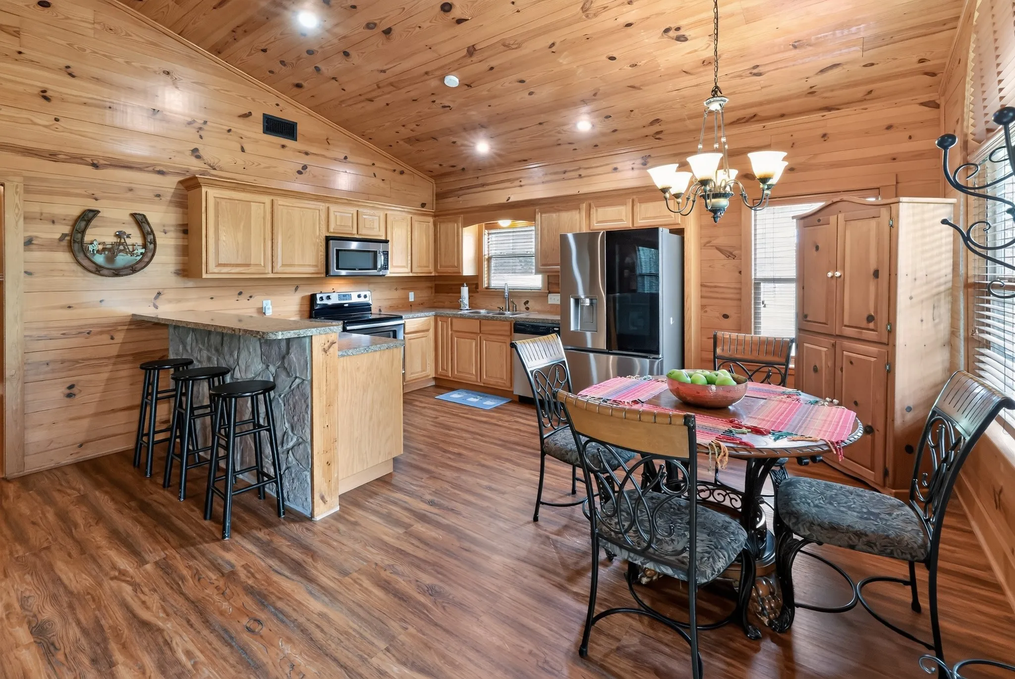 Open-concept kitchen featuring stainless steel appliances.
