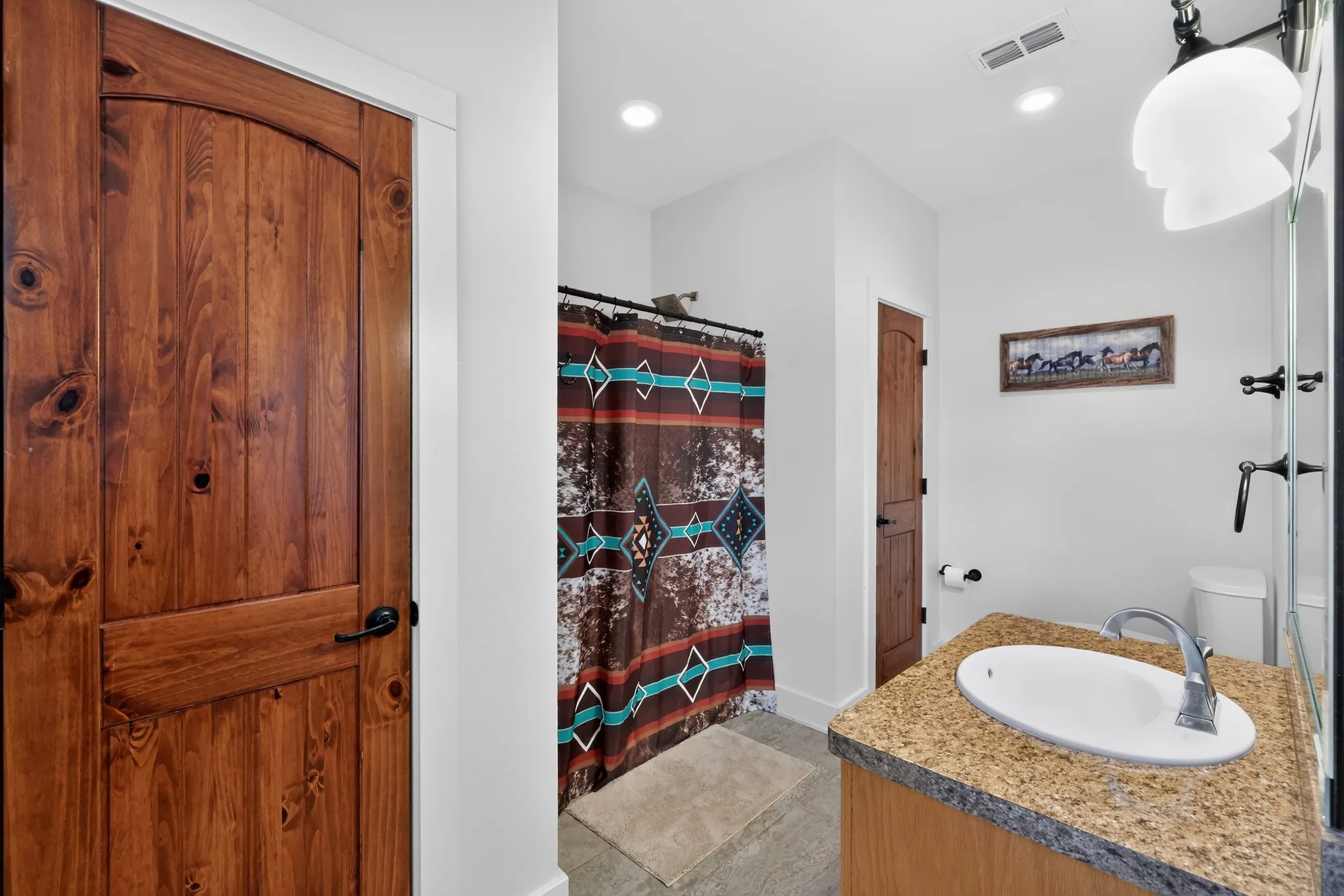 Private full bathroom connected to the secondary bedroom.