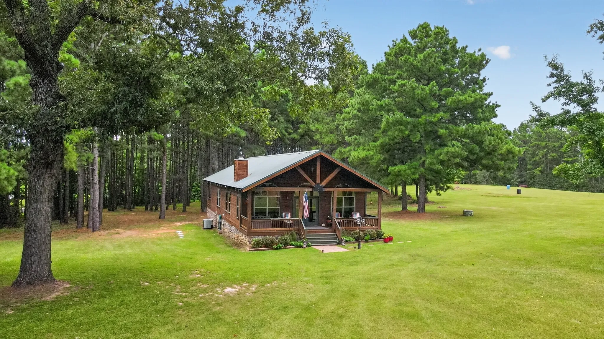 Picturesque front exterior on 20.82 acres.