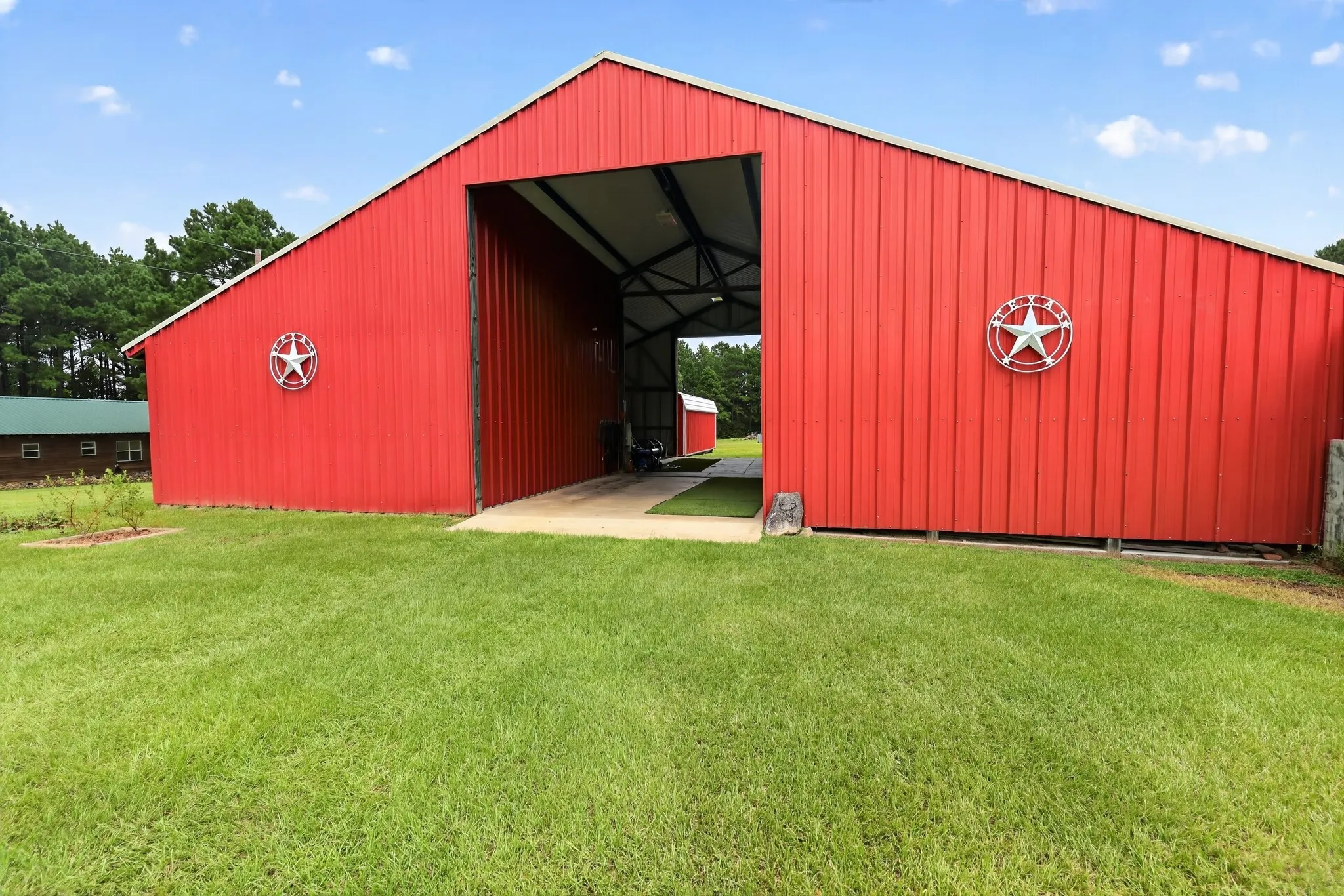 Horse barn with oversize drive-through RV storage and full hookups.