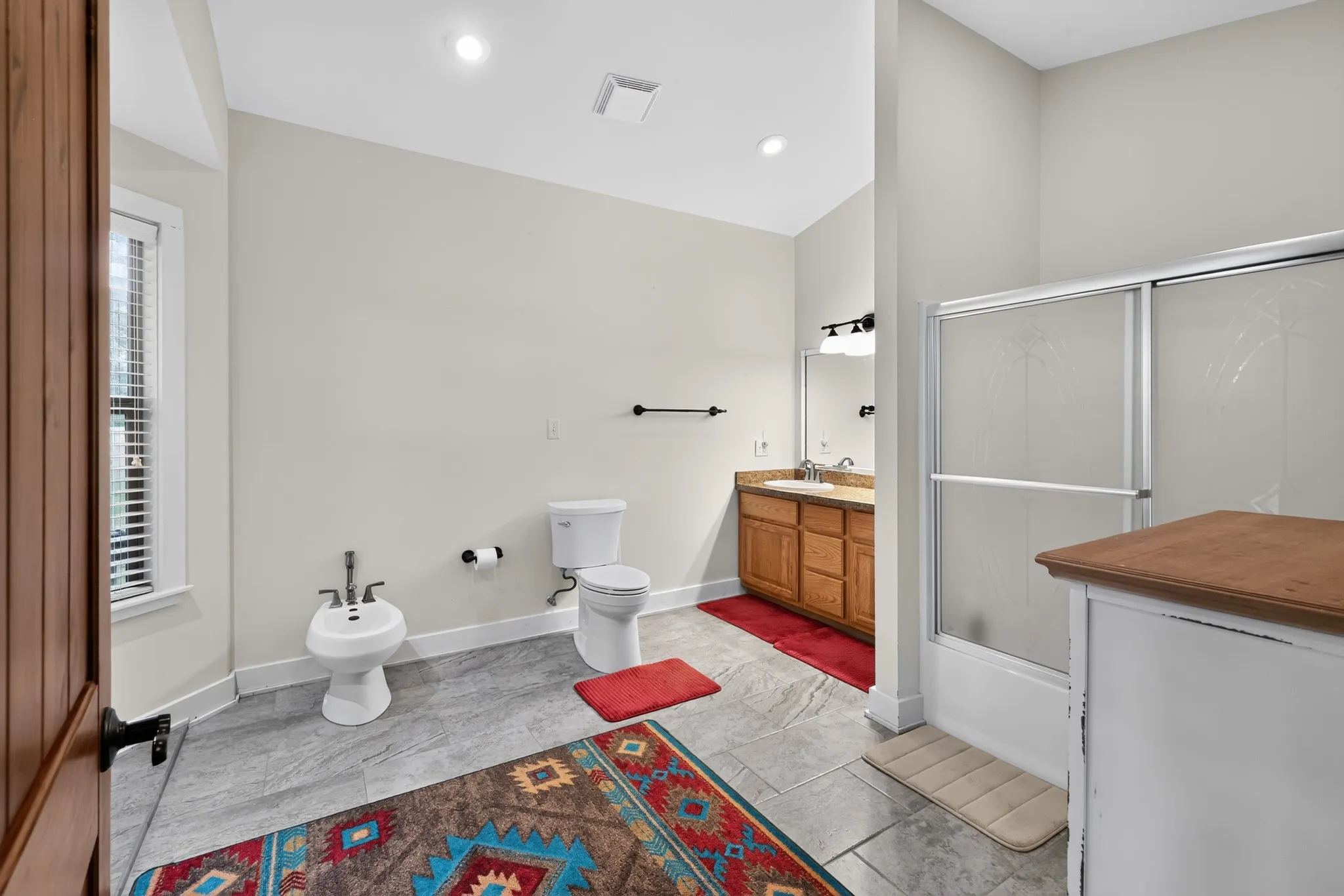 Master bath featuring a bidet.