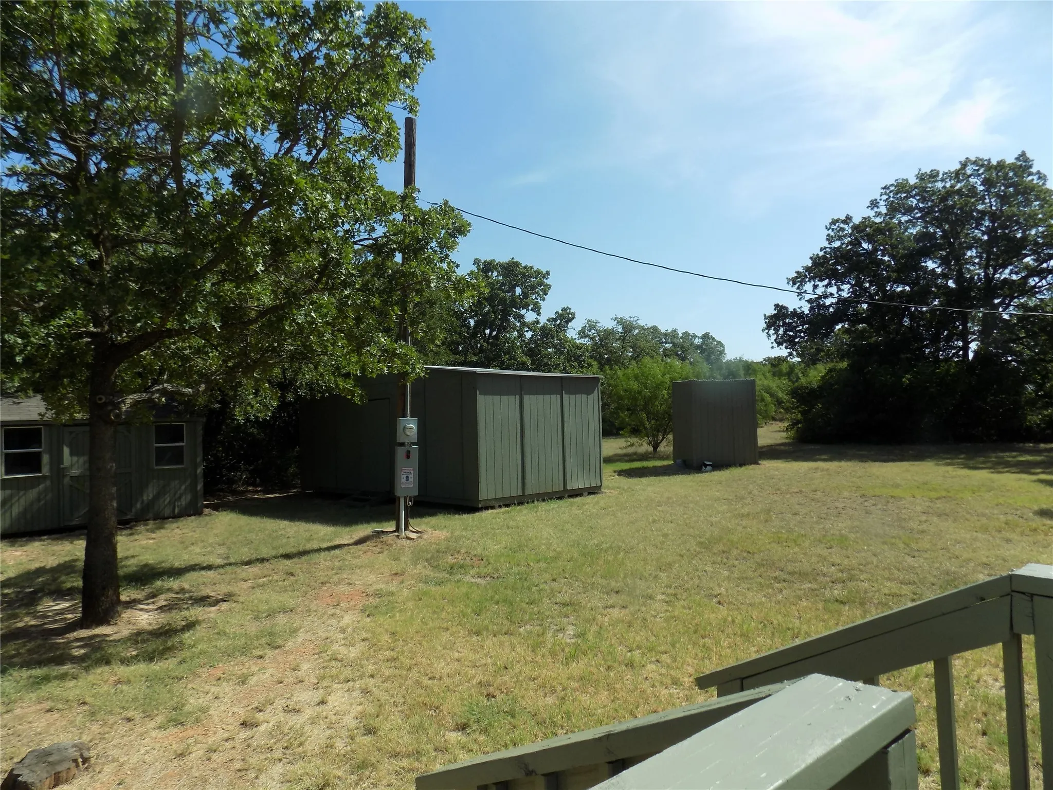 View of out buildings and well house.