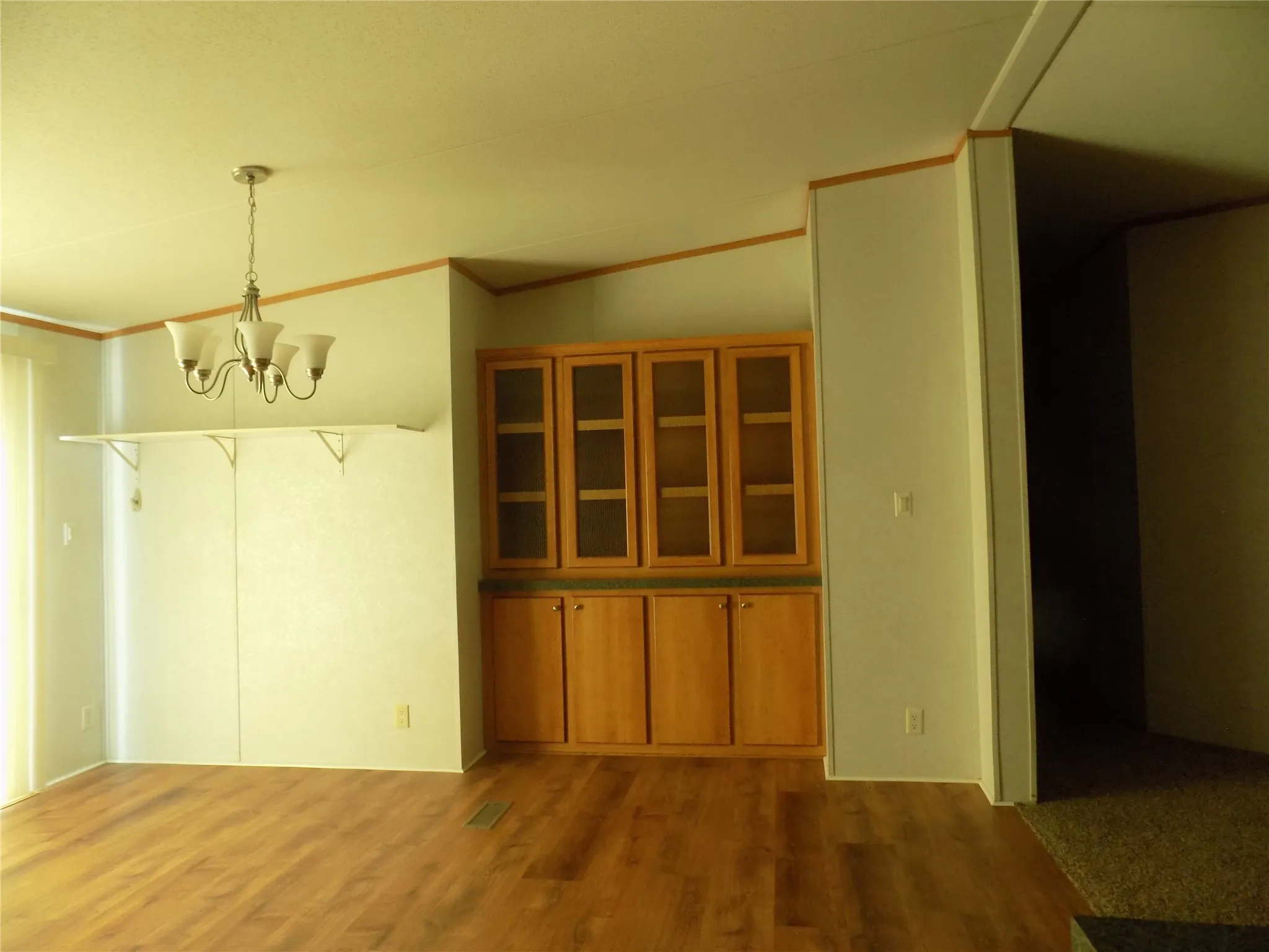 Built-in china cabinet in dining area, offering additional space for special items.