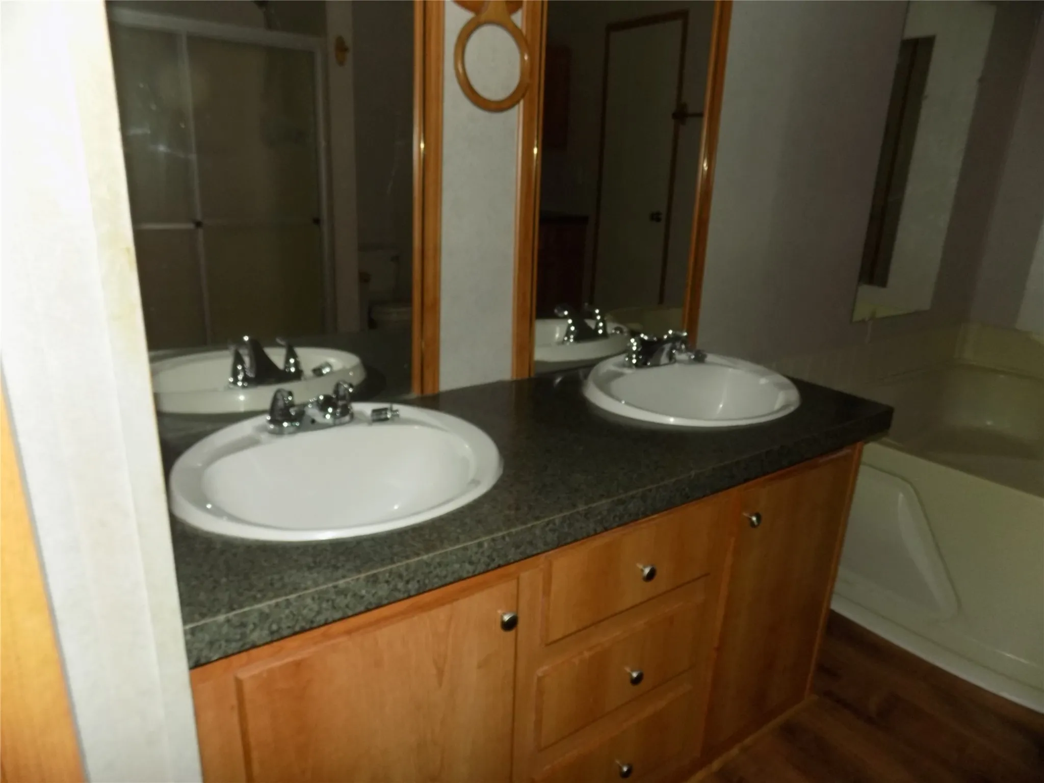 Dual sinks into the large en-suite bathroom attached to primary bedroom.