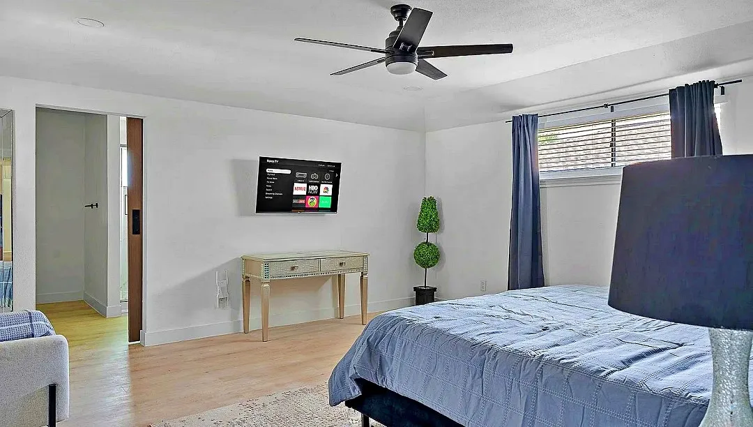 Light wood-finish flooring with white walls