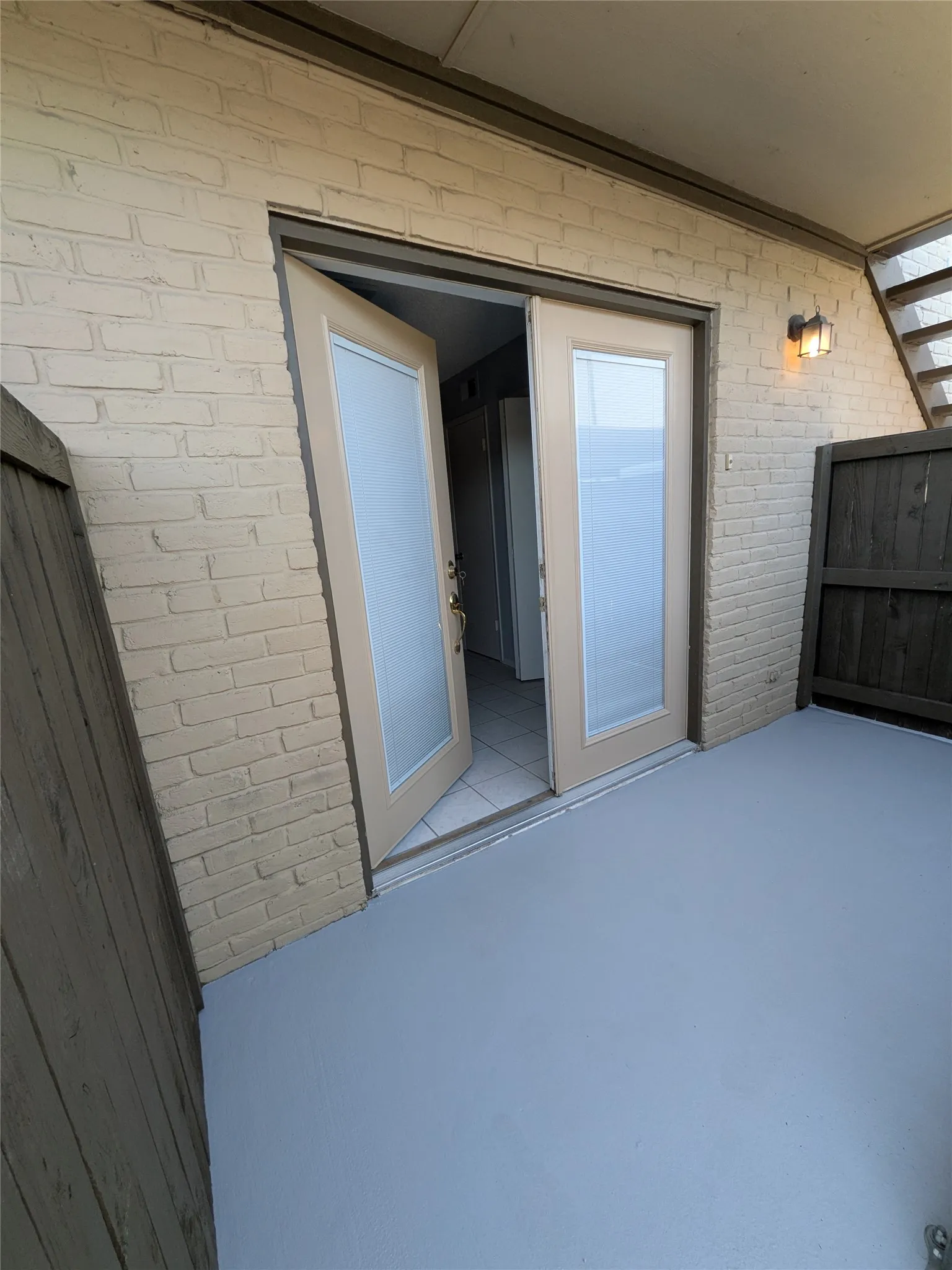 private fenced patio off kitchen