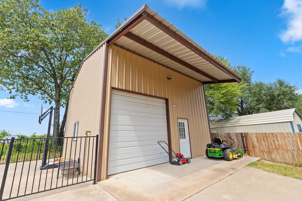 This outbuilding is 24x24, with a roll-up garage door.