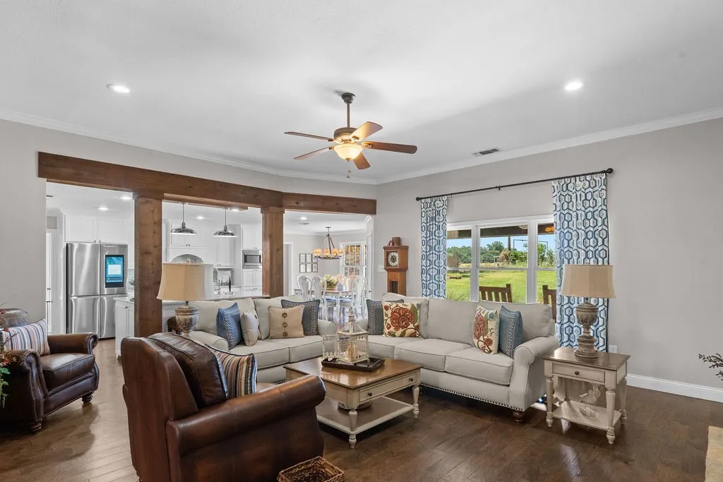 Enter into a modern and elegant open plan space.  10 -foot ceilings in the living room, with engineered hardwood floors, and cedar beams framing the kitchen