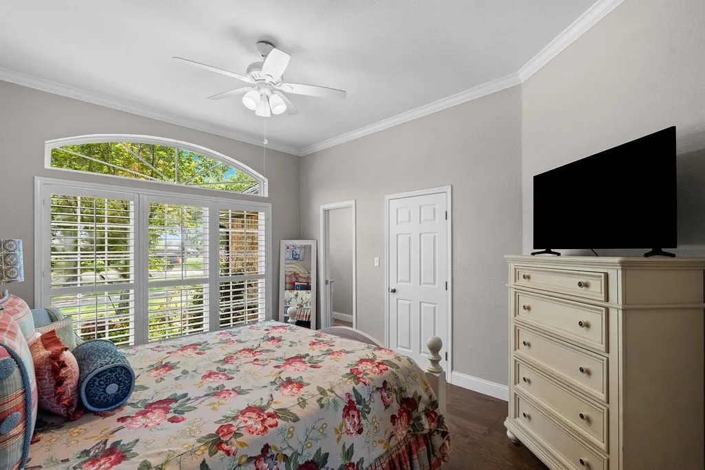 The bonus room off the living area has a full ensuite bath, plus closet.  It's currently in use as a fourth bedroom, but could be a an office, craft room, or guest suite. Check out the gorgeous triple window with fan window above!