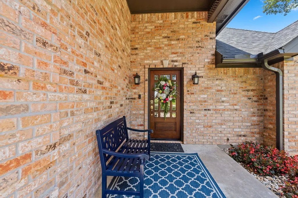Shaded front porch is perfect for morning coffee or birdwatching among the mature trees out front.