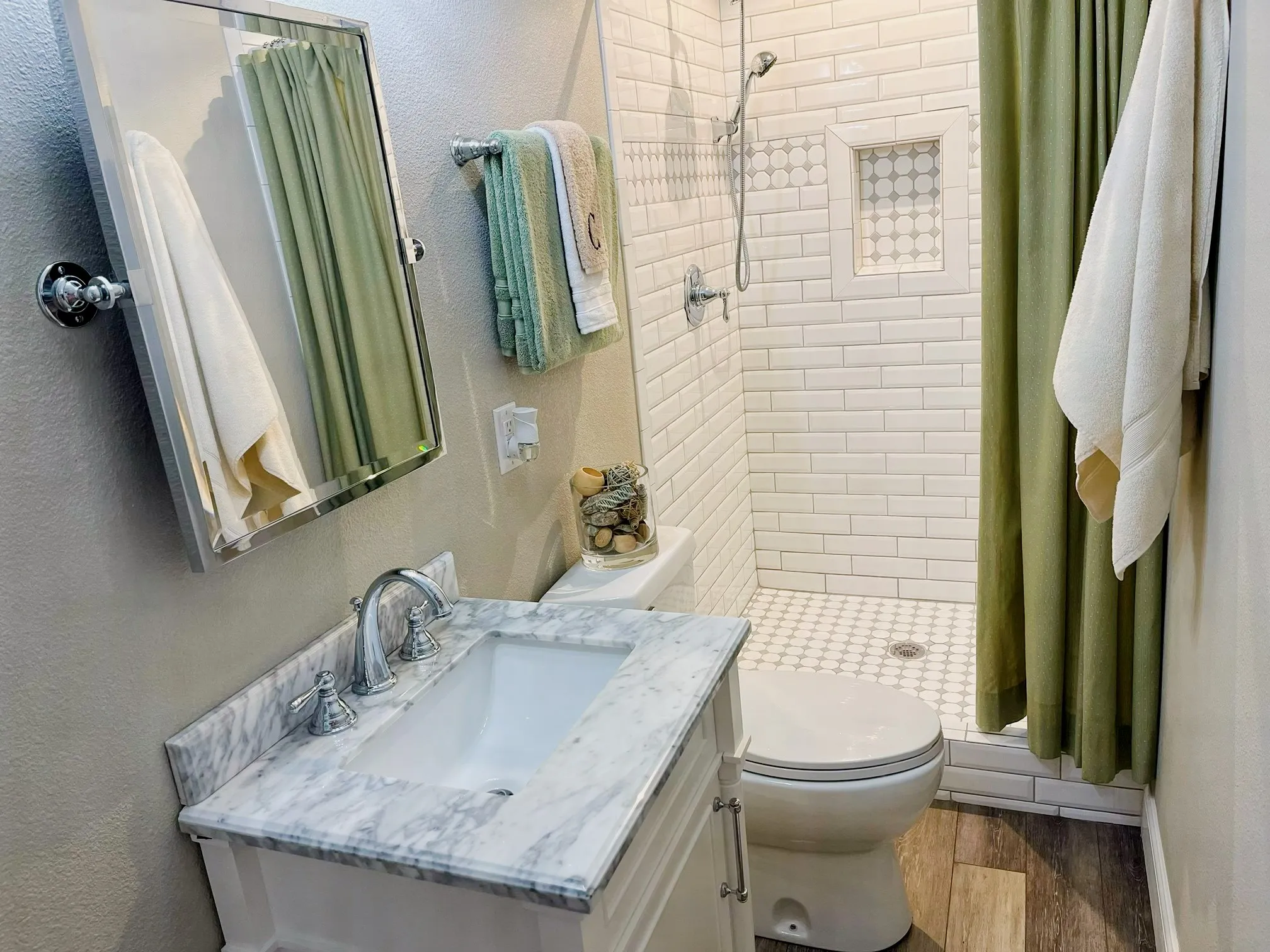 Ensuite bath in the bonus room has granite-topped vanity and fully-tiled shower.