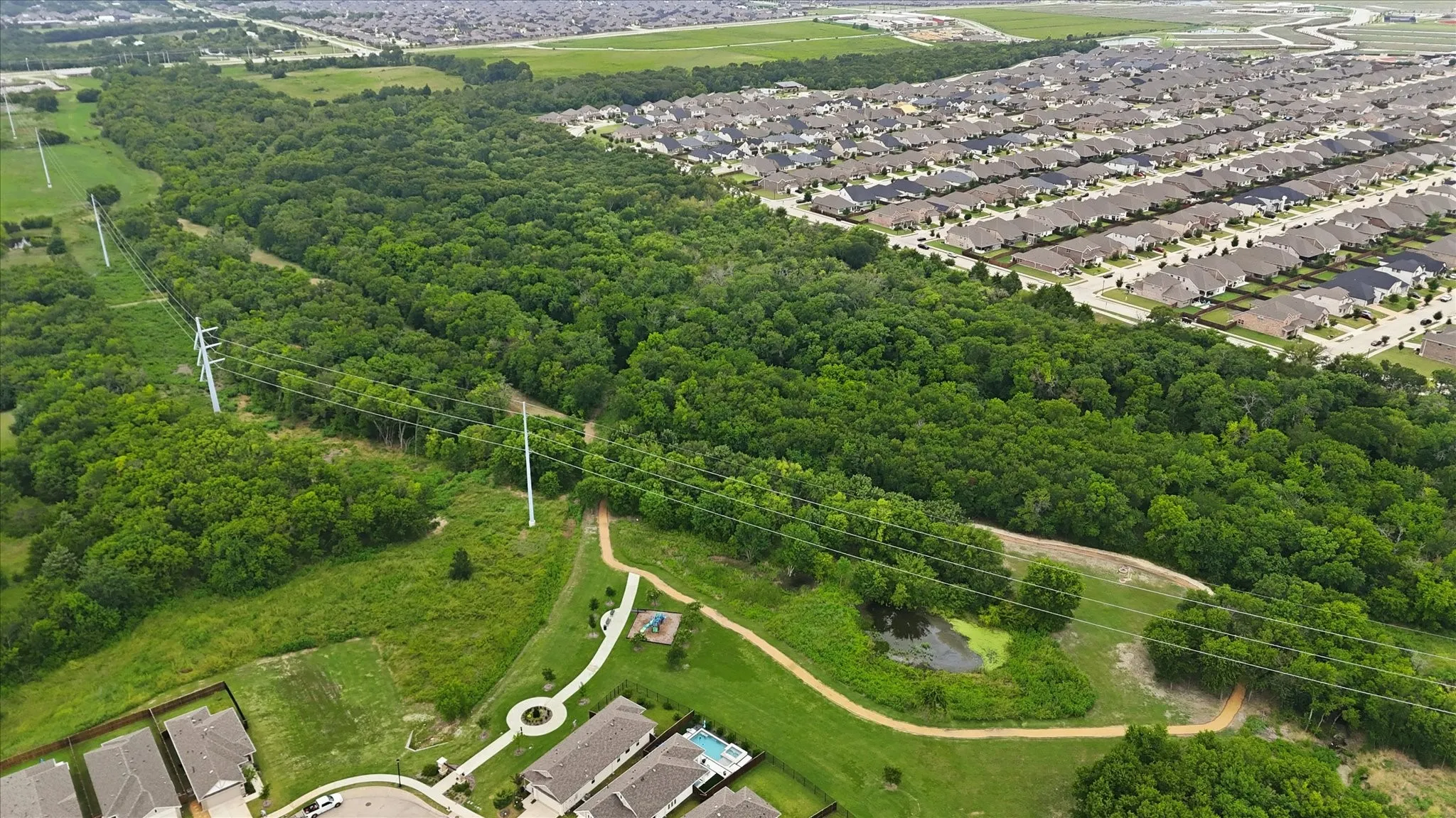 Extensive greenbelt area featuring mature trees and established residential housing