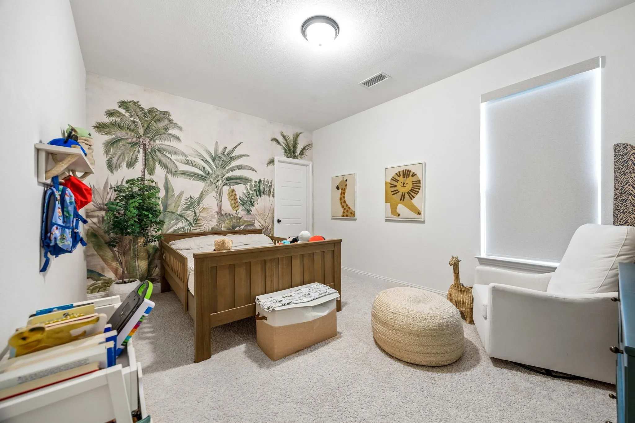 Light-colored carpeting throughout, white painted walls, and built-in shelving