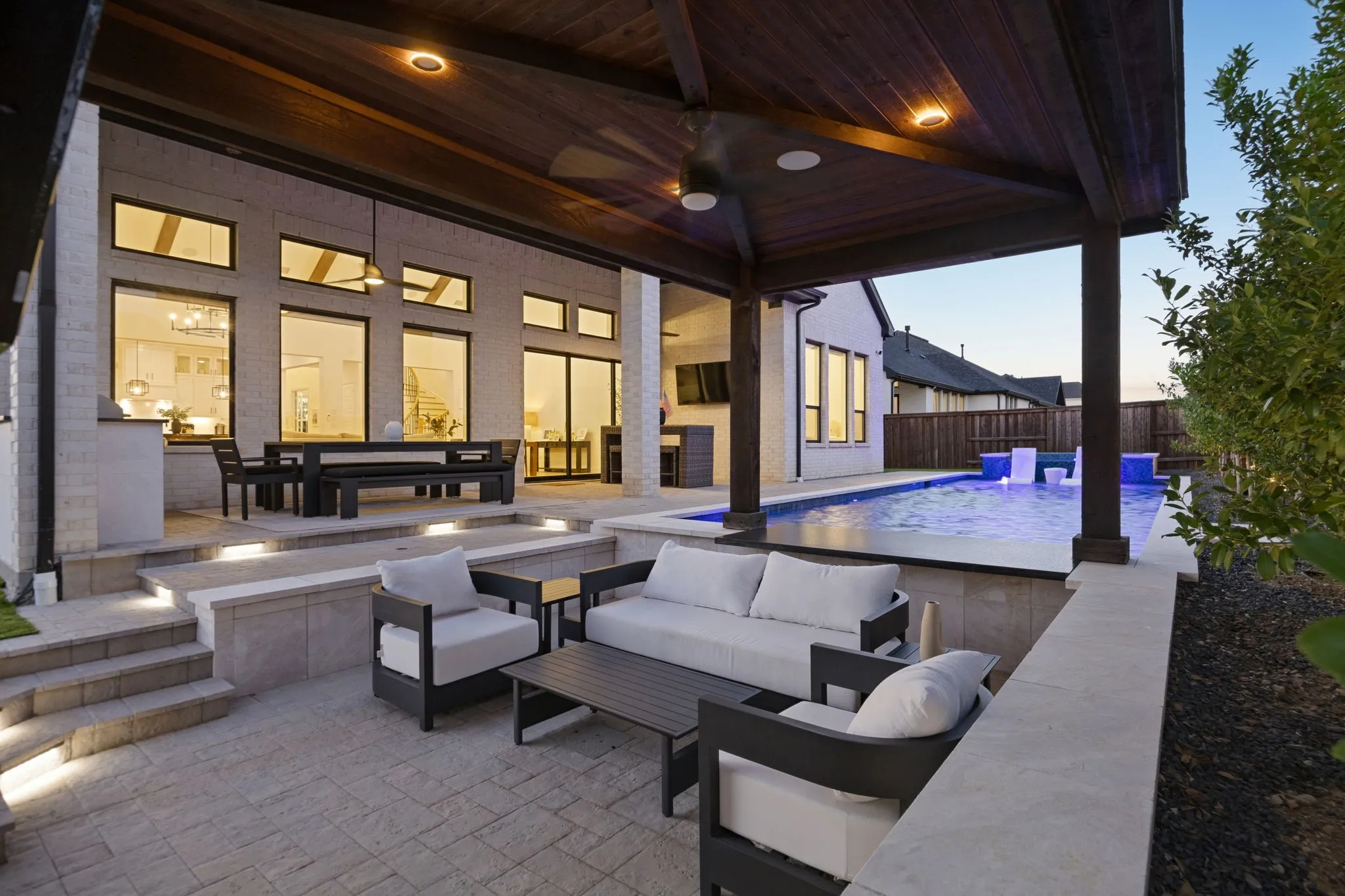 Outdoor seating with fireplace and tv