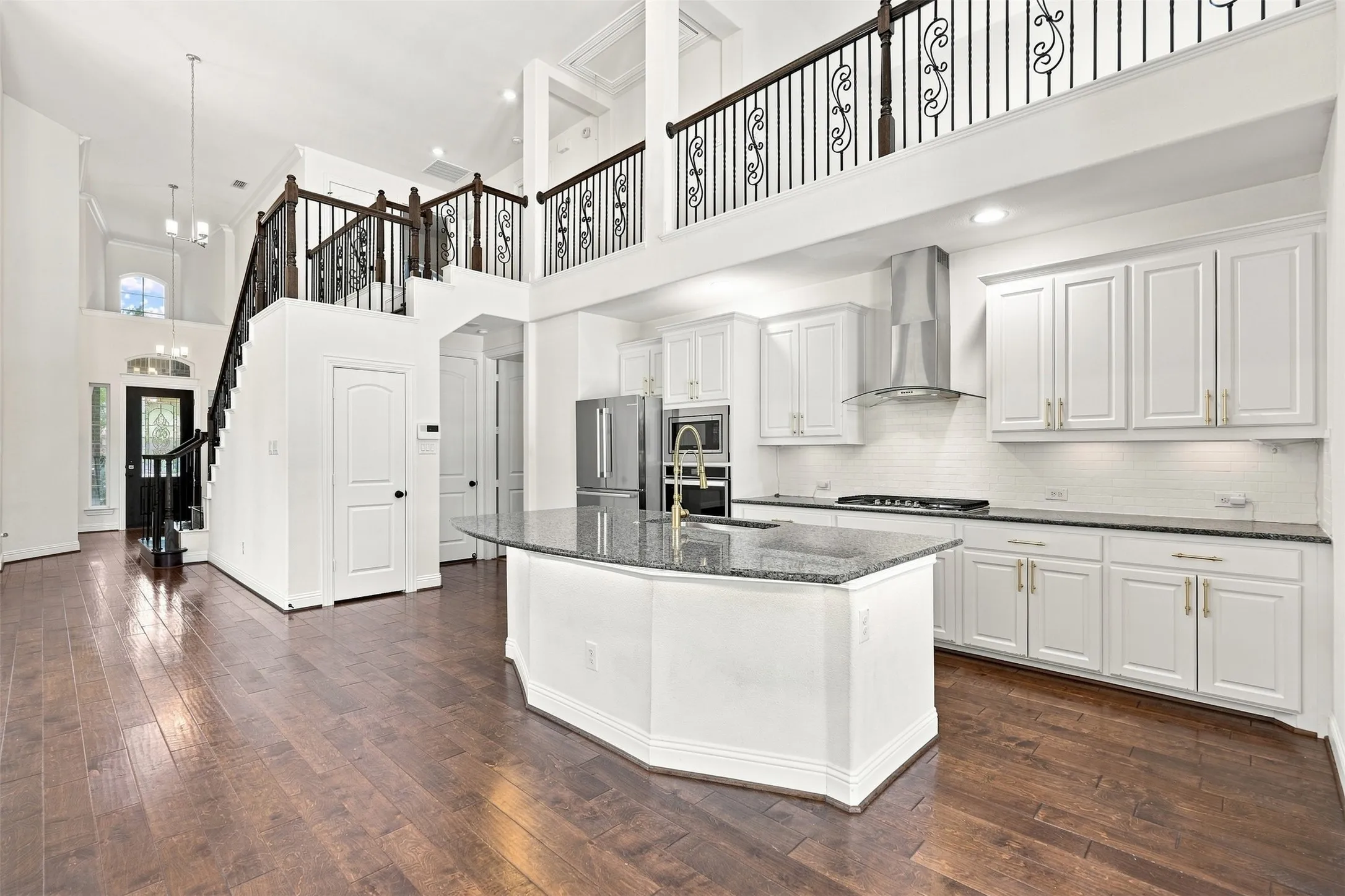 Two-story interior with wood-finish flooring