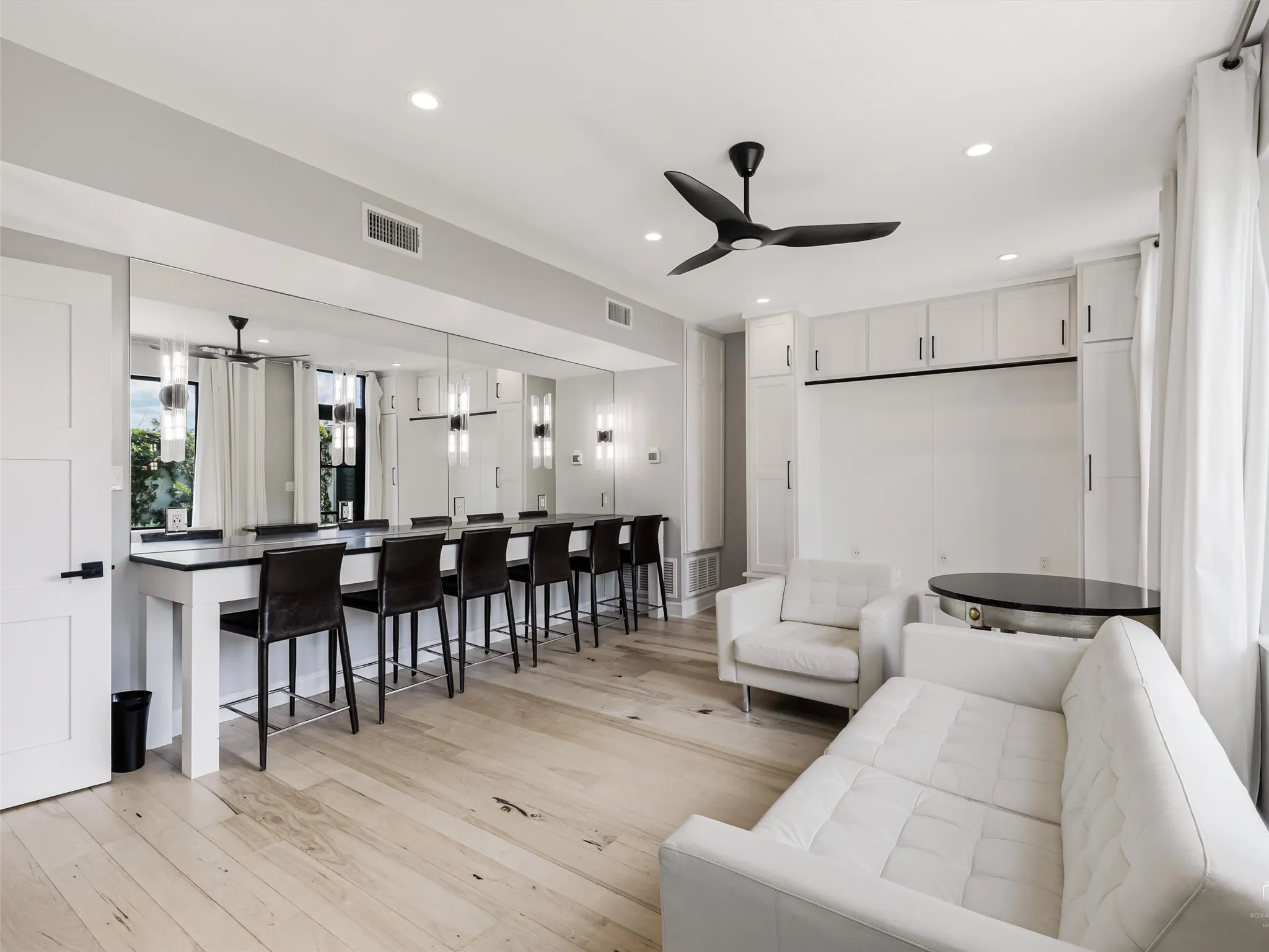 Bridal suite with makeup chairs, hollywood mirrors and a relaxing seating area.
