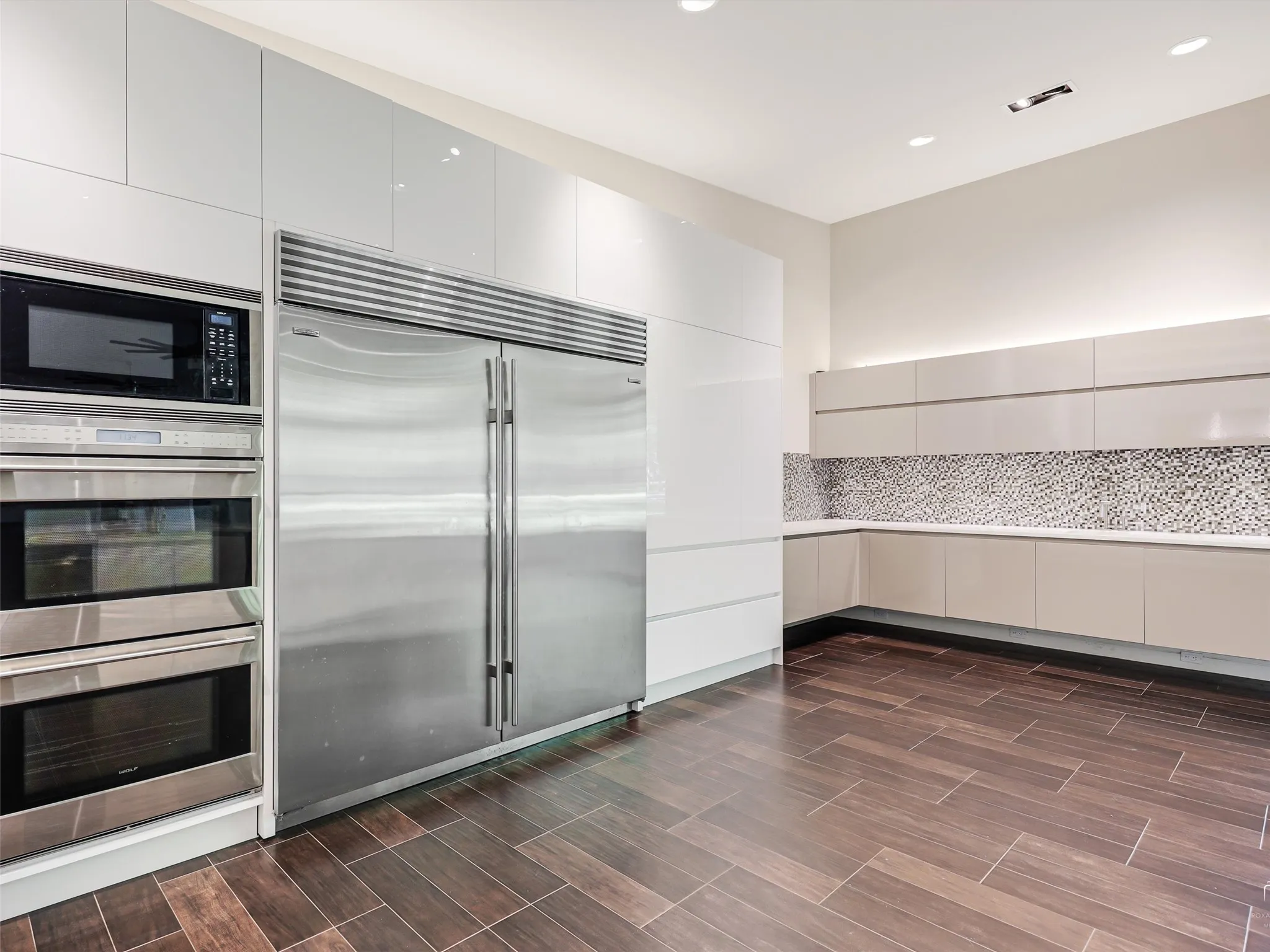 Commercial kitchen with tons of counterspace, freezers, refrigerators, warming drawers