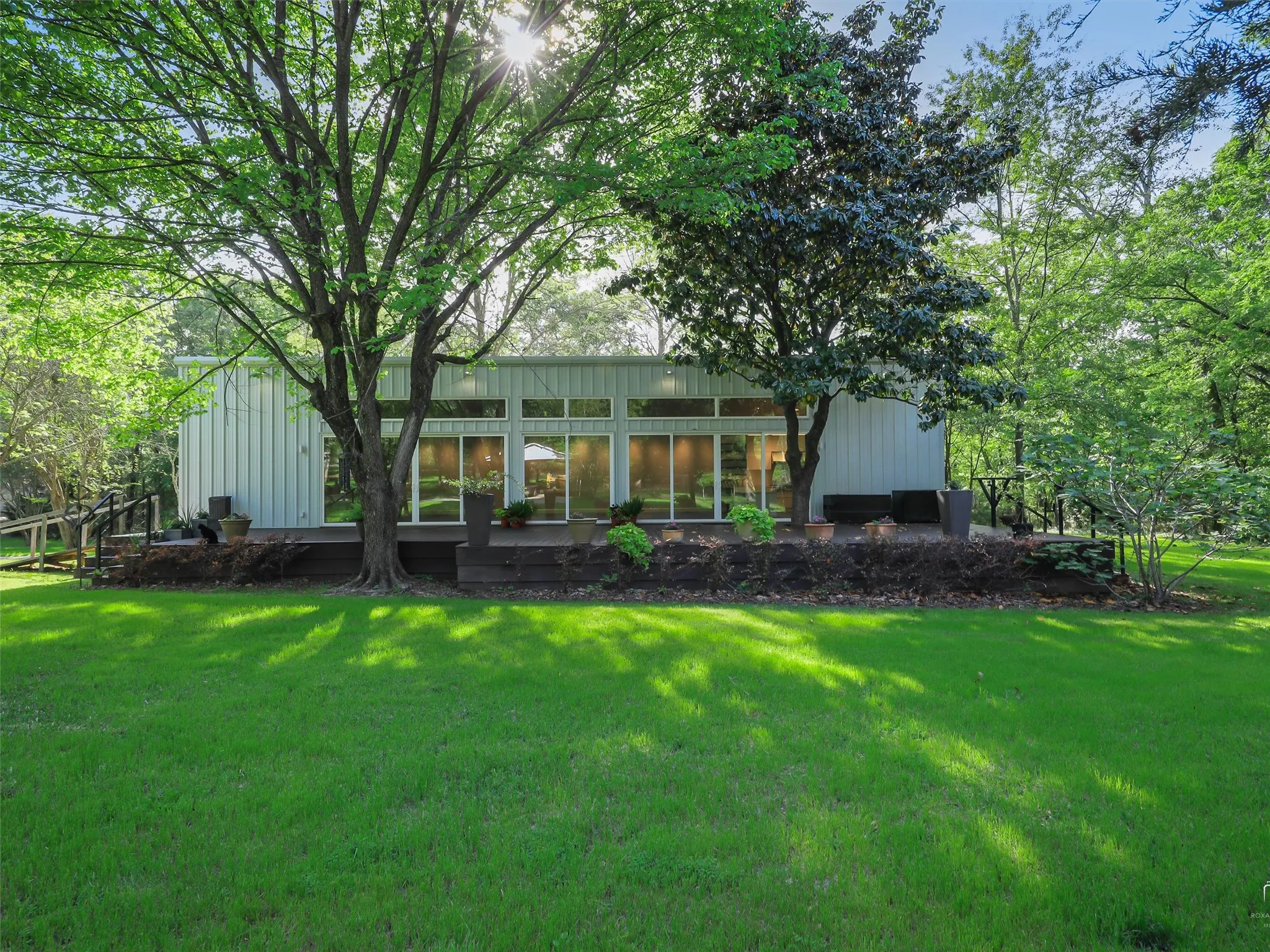 Brick House: In addition to this structure, there is
a 37-year-old, 1,254’ brick home with
metal roof on slab foundation with
covered porches, wood deck,
pergola, storage carport, detached
624’ workshop, and storage
sheds/wellhouse on the property