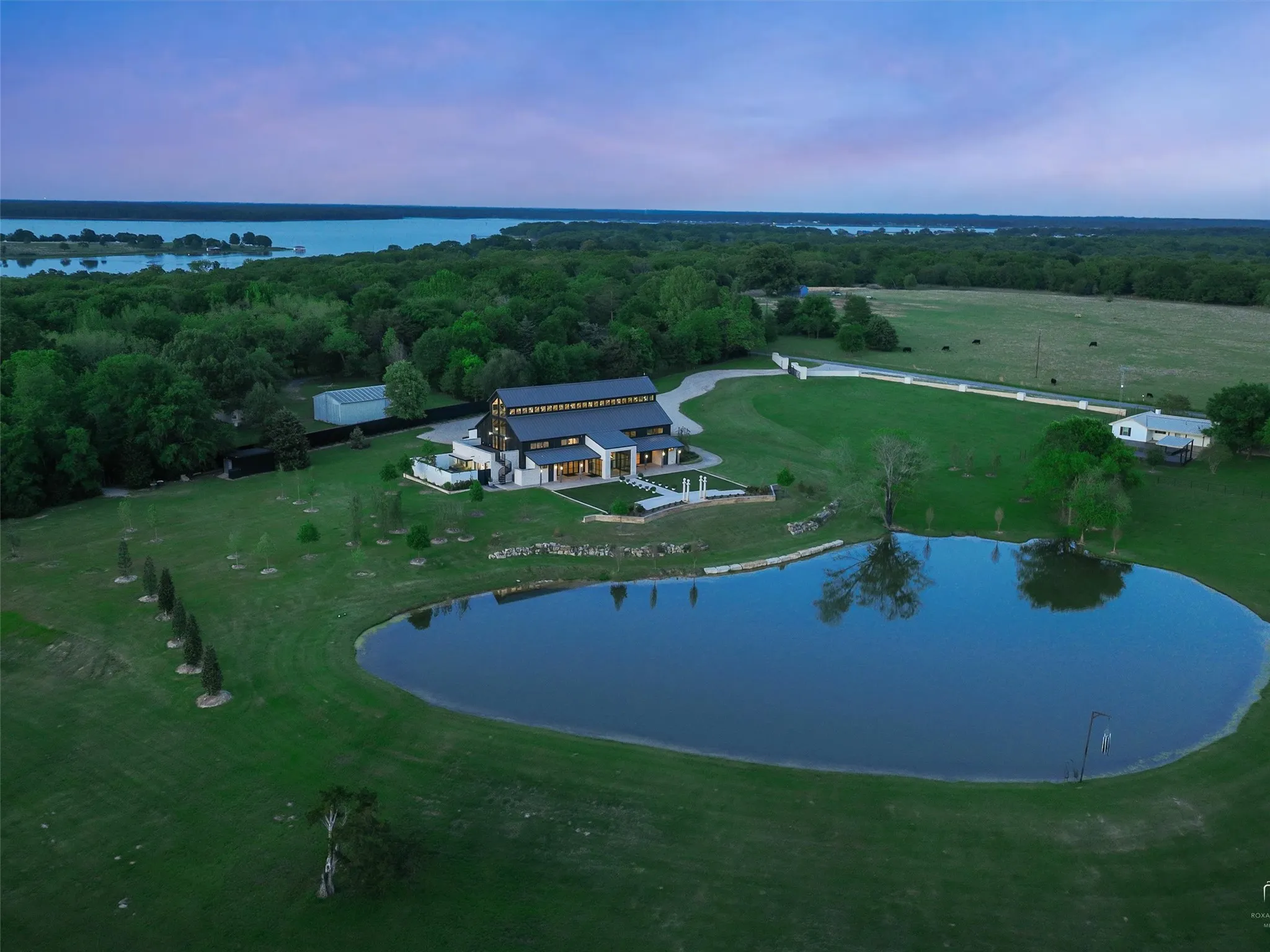 Scenic estate filled with mature trees and landscaped grounds that create a peaceful environment for events or private retreat use.