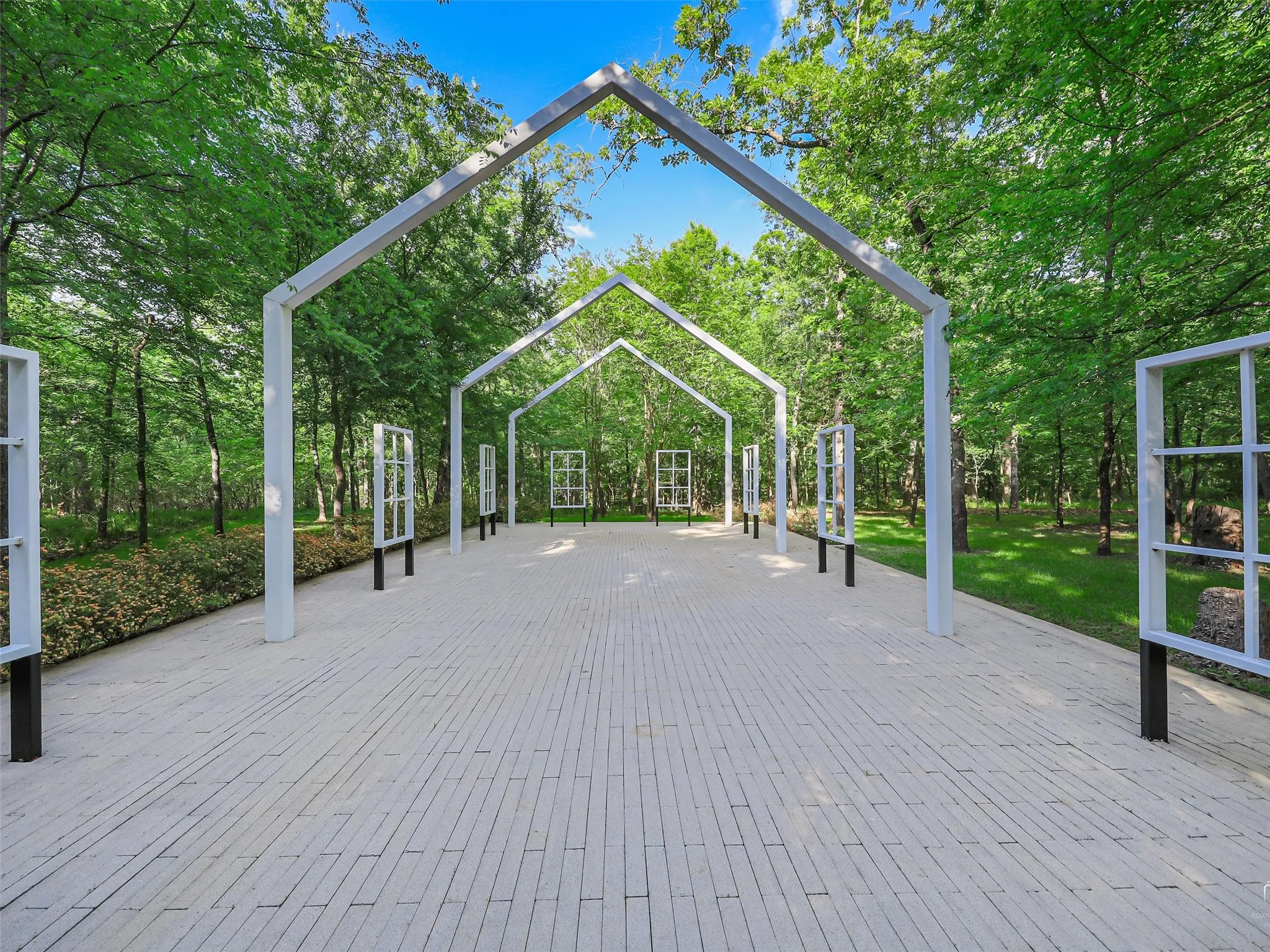 This building was inspired by the Historic Pole Green Church outside of
Richmond, Virginia. The chapel has a paved floor and will seat 75
people theater style.
Surrounded by towering trees, a long rock-hopping path for kids of all
ages, and a triceratops, this wooded area is ideal for shaded outdoor
events.