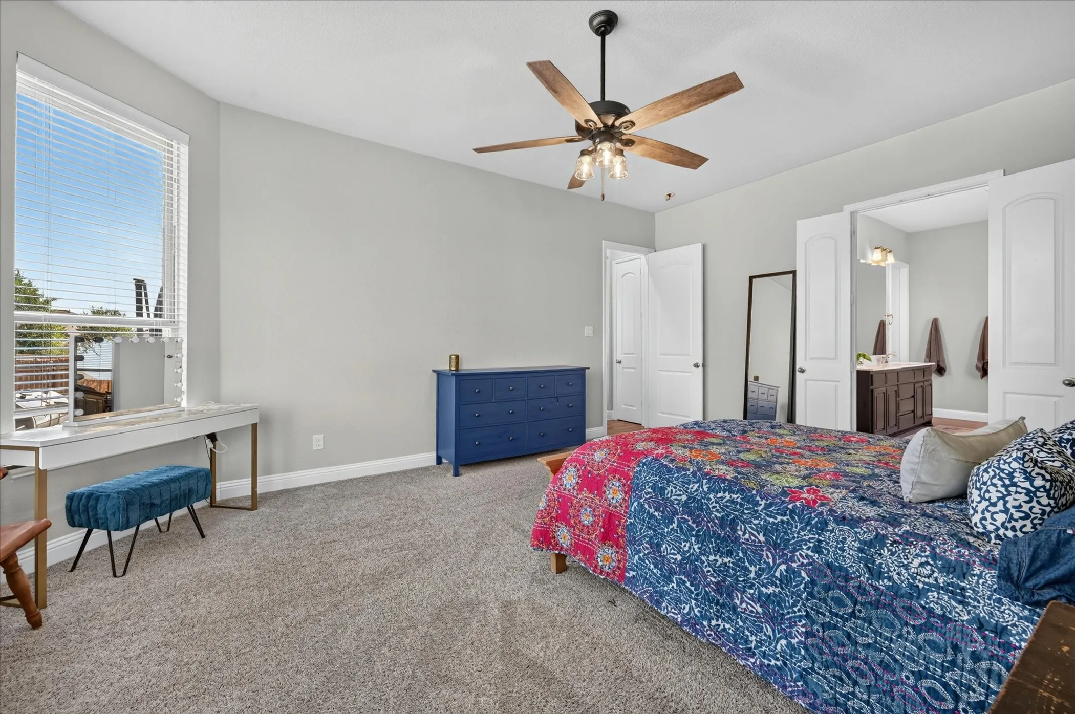 Spacious room featuring neutral carpeting and light gray wall paint