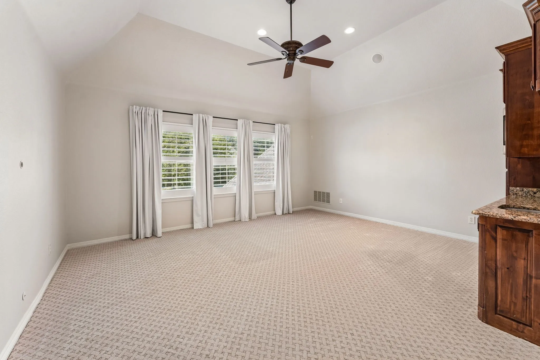 Game Room with cabinets, microwave and mini fridge.