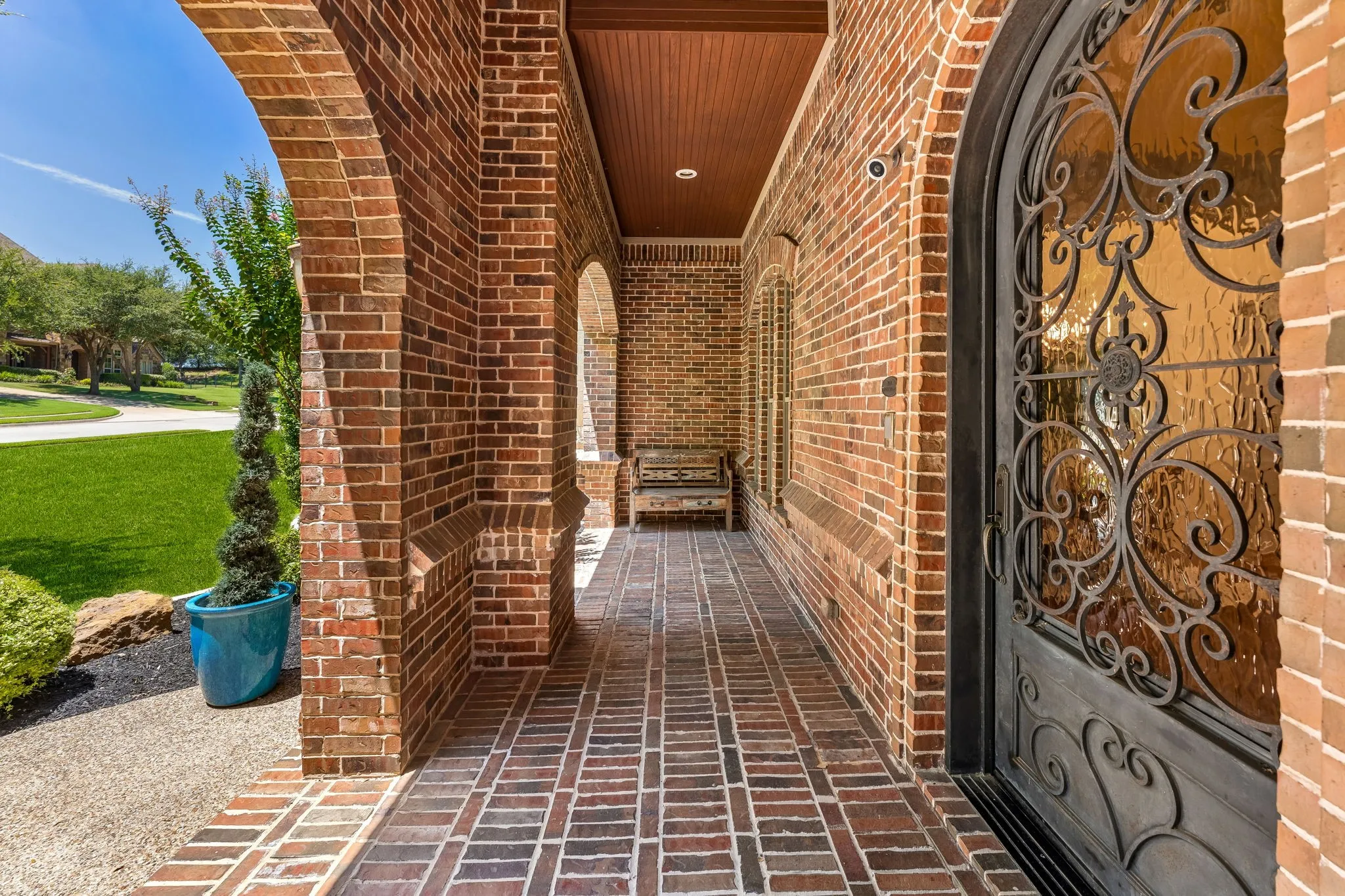 Wood ceiling and oversized custom iron door.