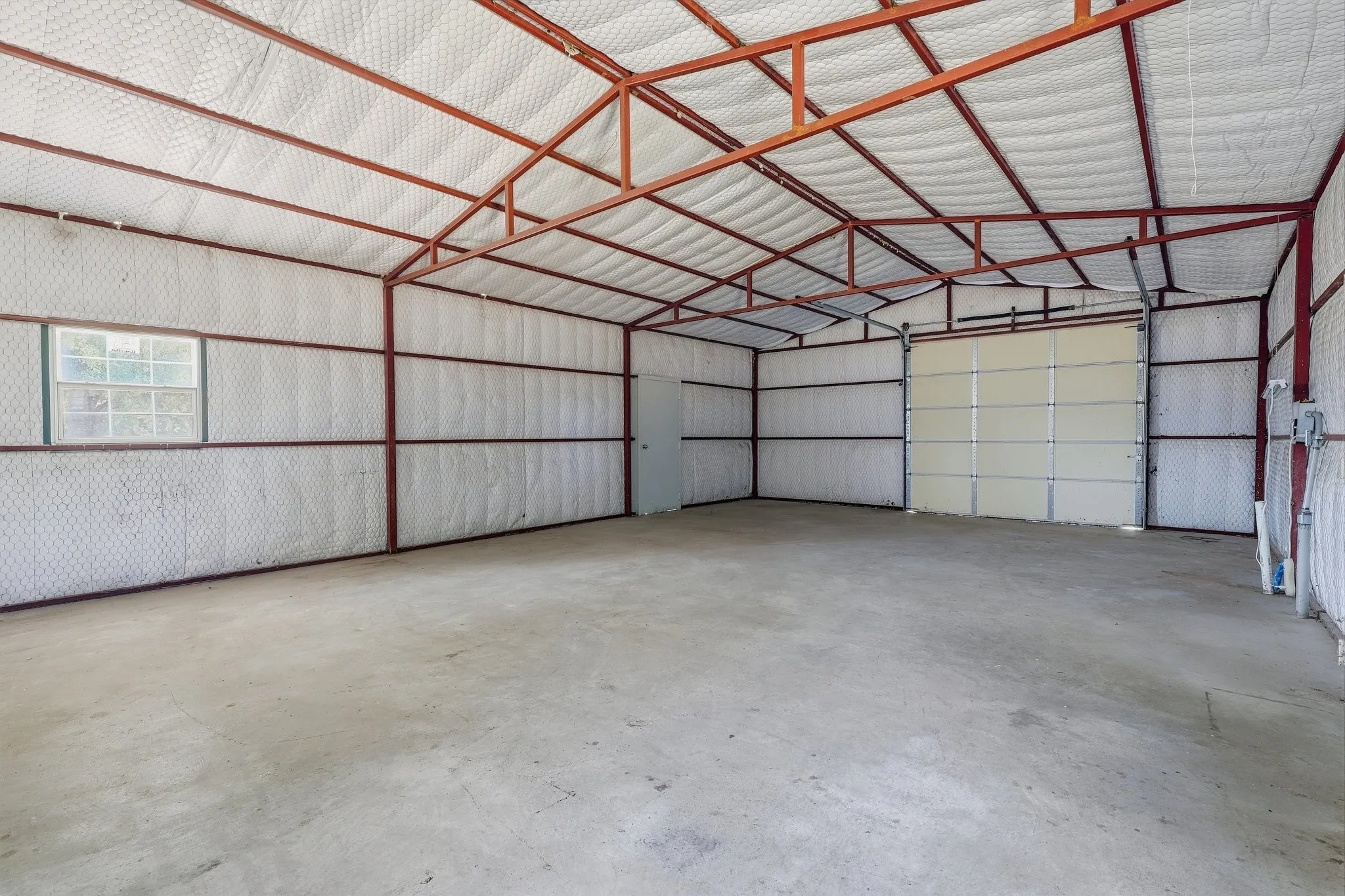 Workshop with a large garage door.