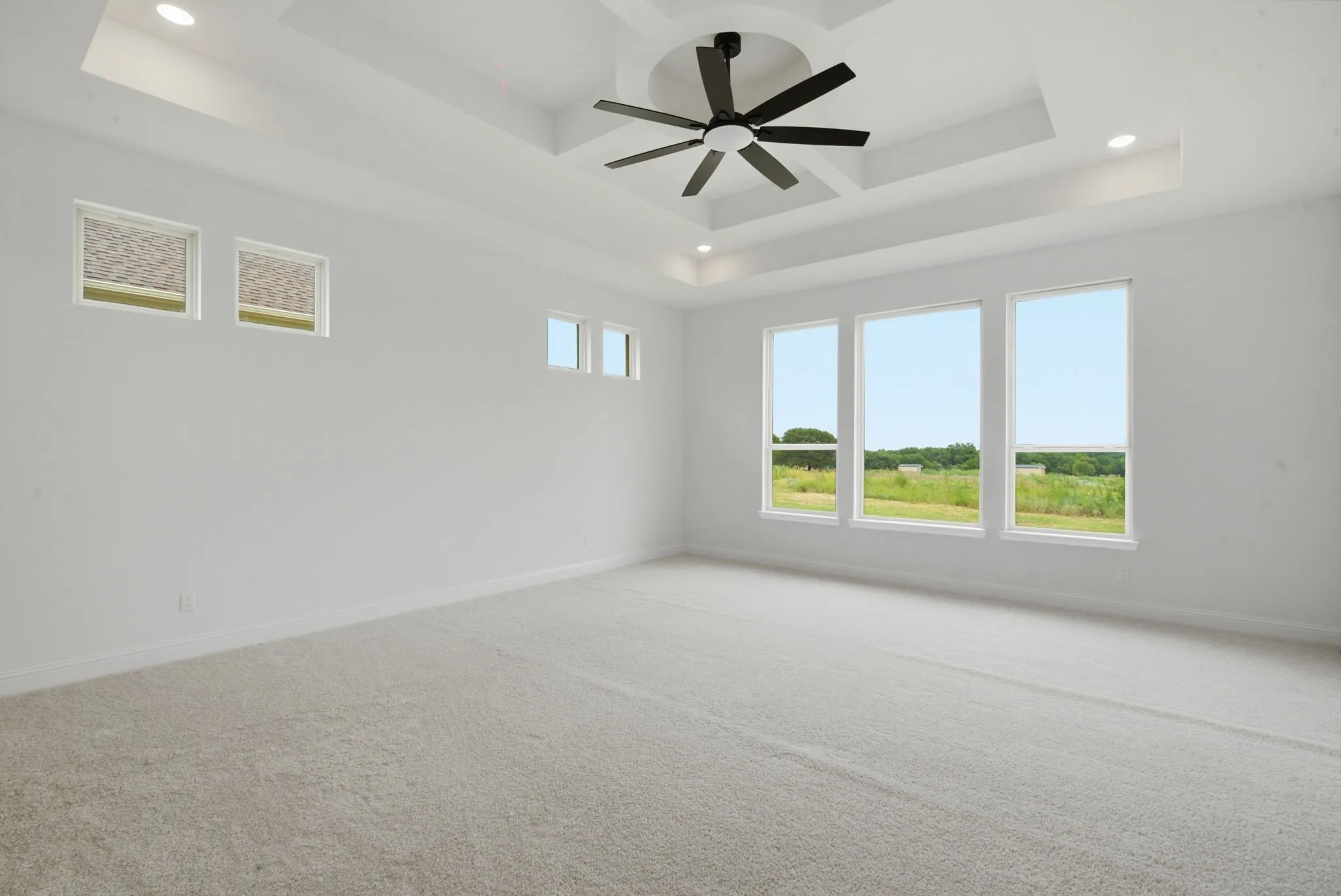 Primary ensuite bedroom with large windows to enjoy the serene countryside!