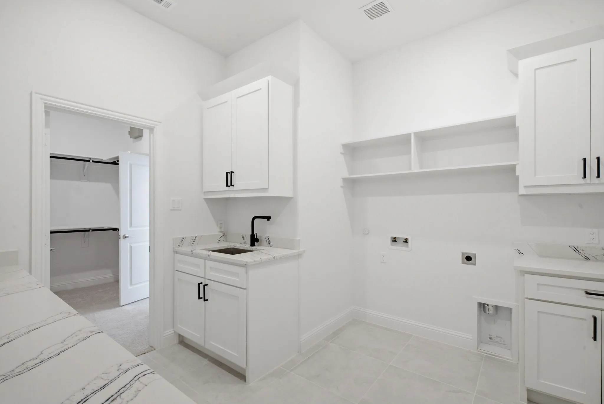 This is the best utility room ever!  You will enjoy doing your laundry in here!