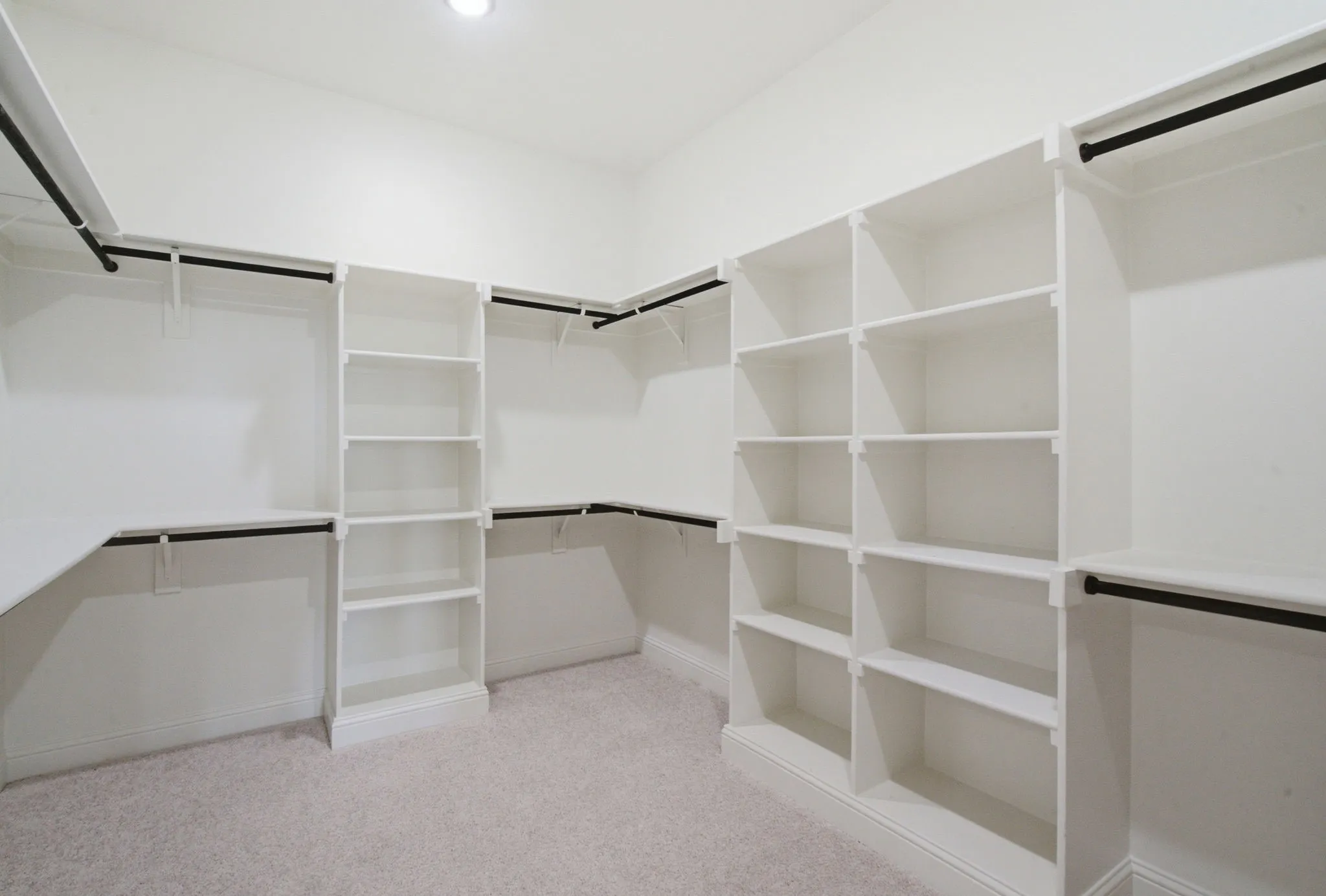 One of two closets in the primary bedroom.