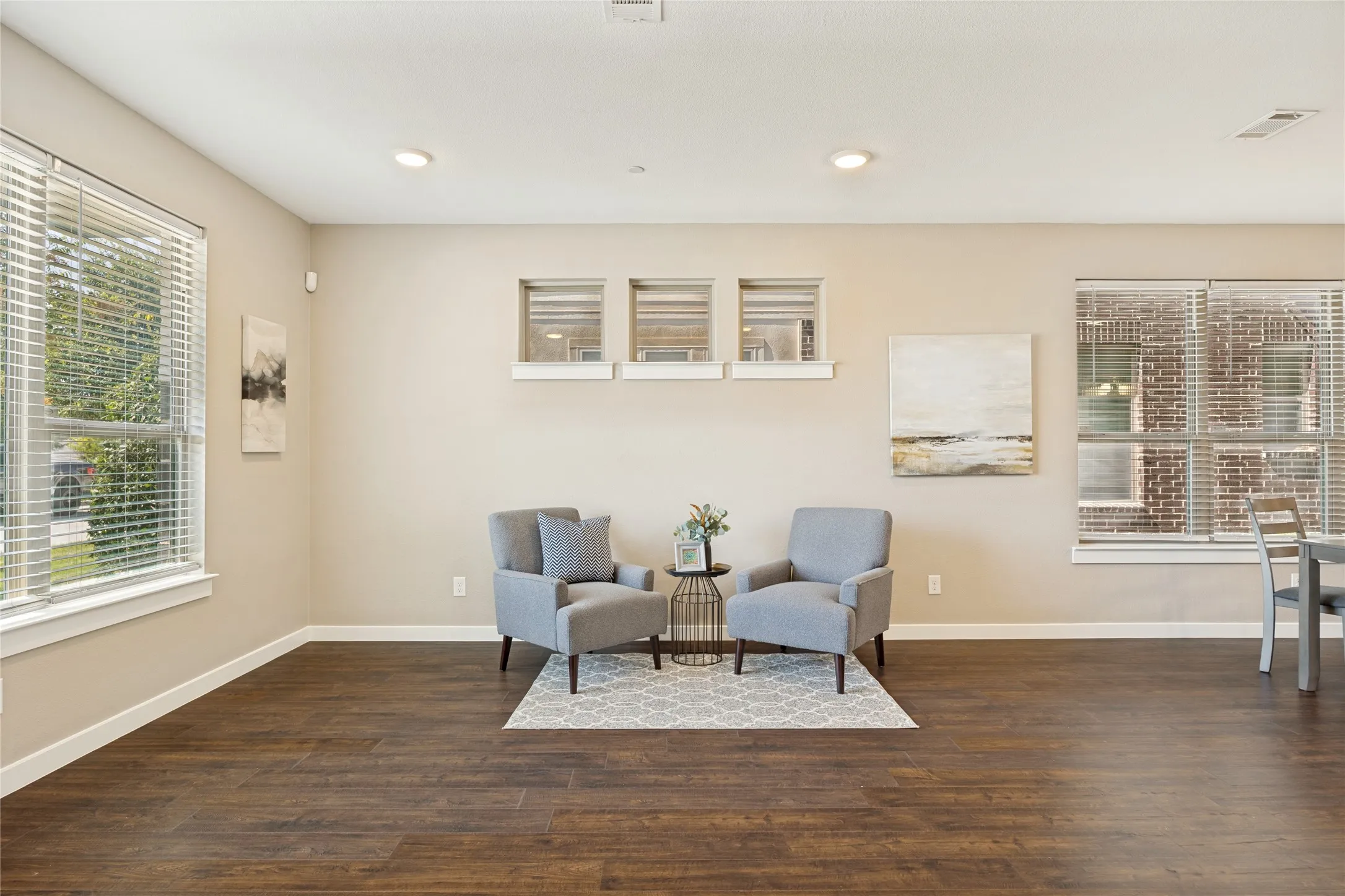 Relax and settle in this charming living area, with perfectly appointed clerestory windows, that allow sunlight to pour in, and maintain privacy.