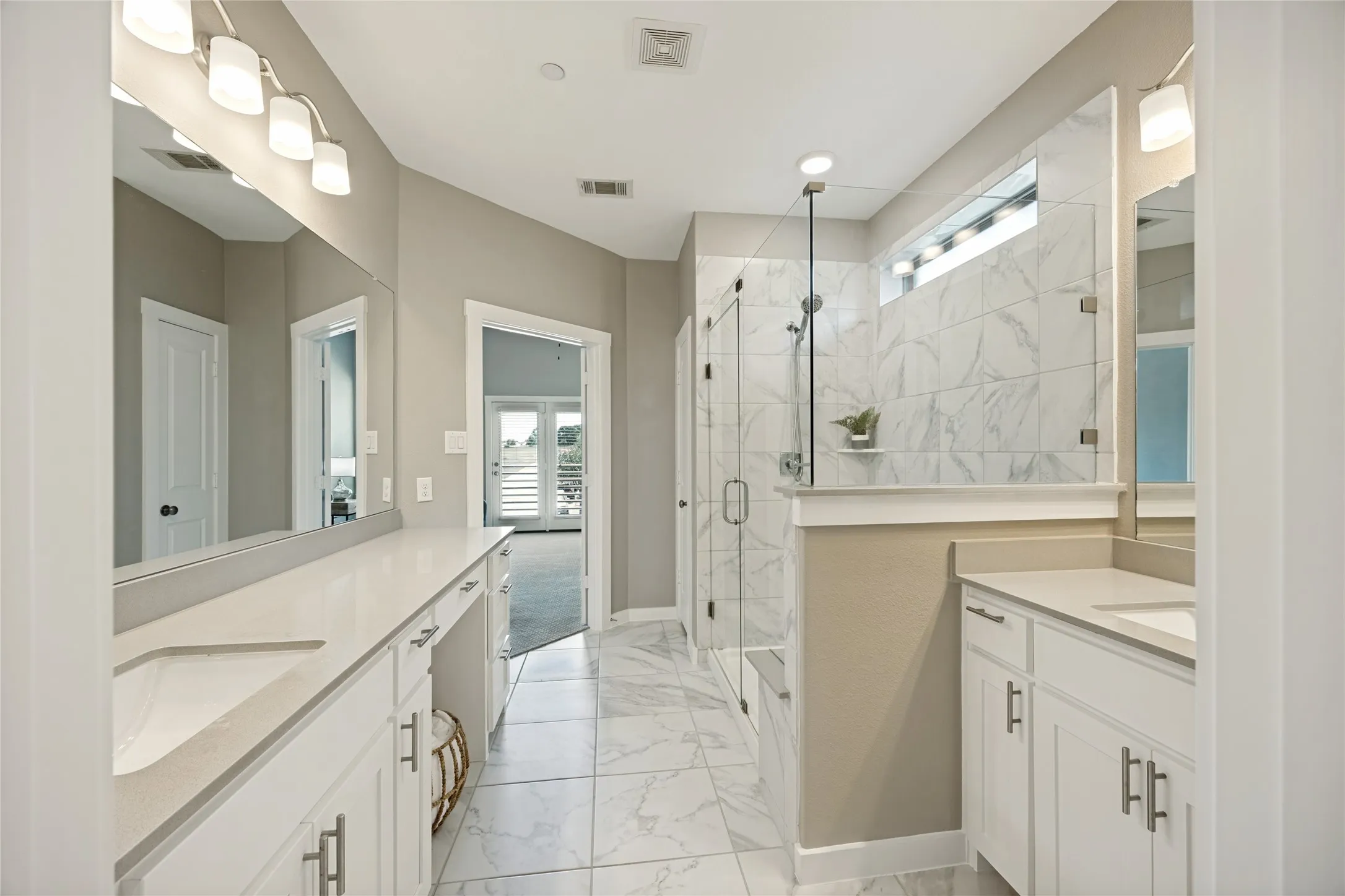 Double sinks and extra counter space, with designated vanity. Also features private toilet room.