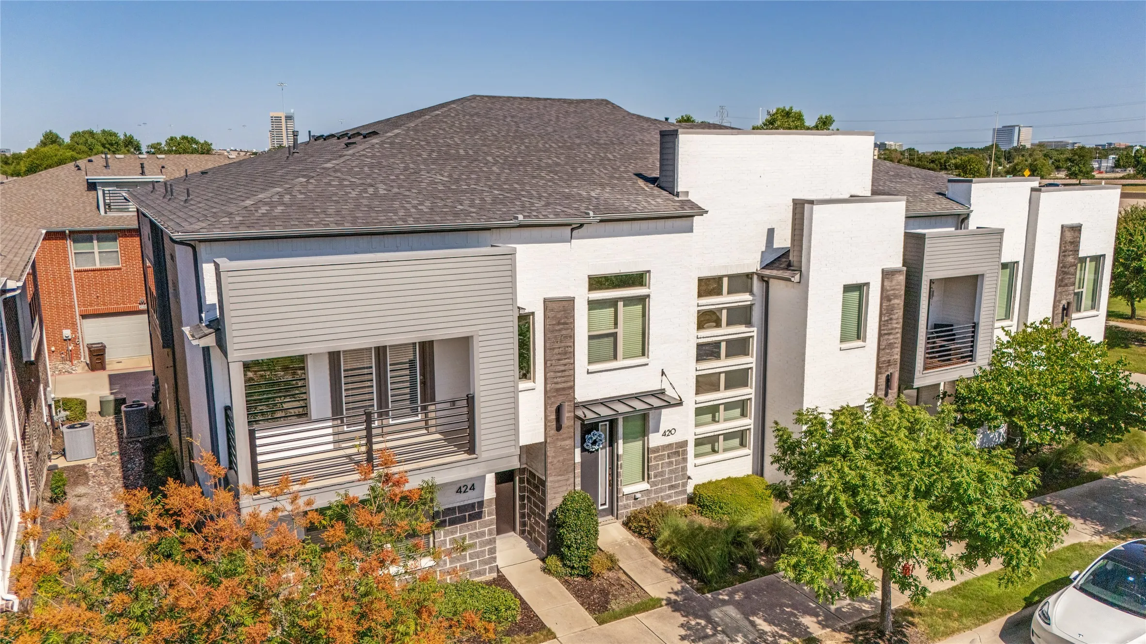 This darling corner unit townhouse features an extended covered balcony off the primary suite.
